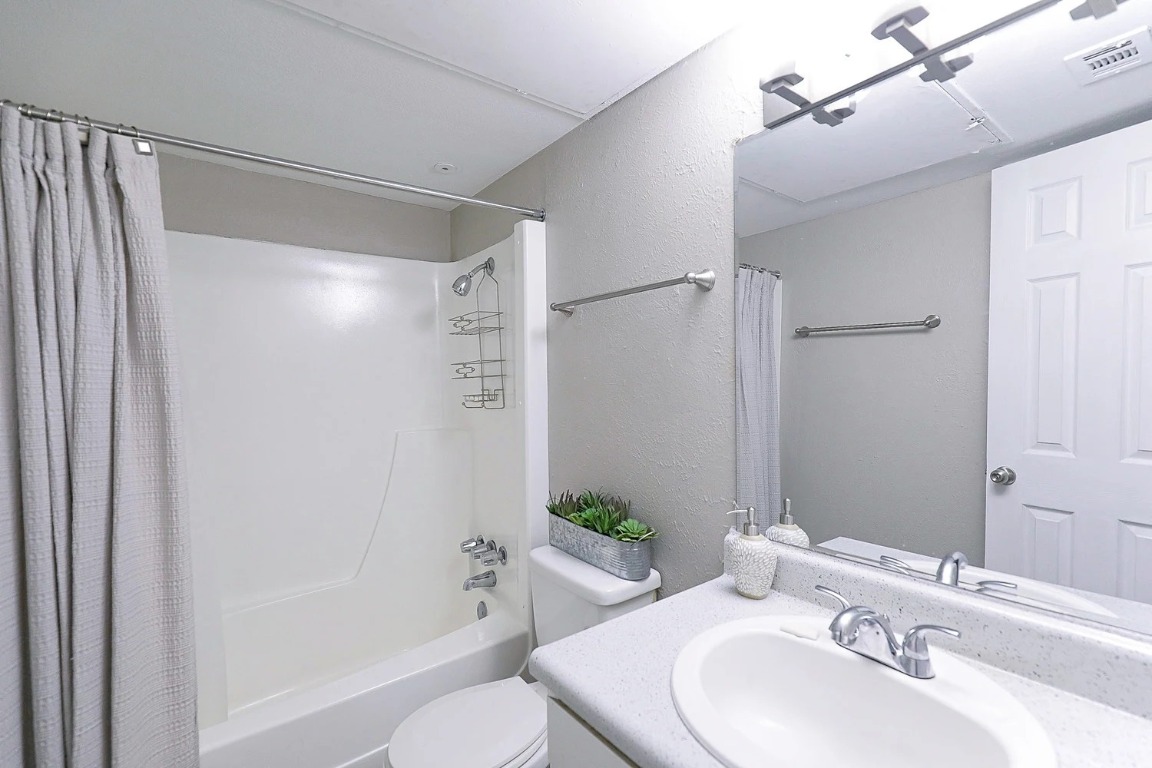 8100 North Mopac Expressway, Unit 5122 Austin, TX 78759 - Photo 18 of 28 a bathroom with a sink toilet and shower