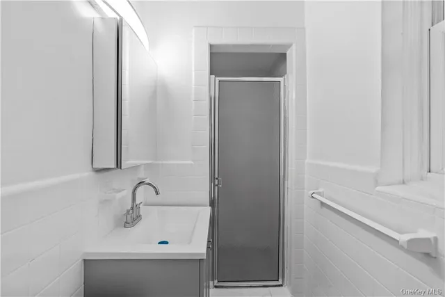 a bathroom with a sink and mirror