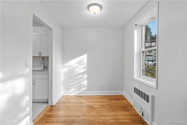 a view of an empty room and window