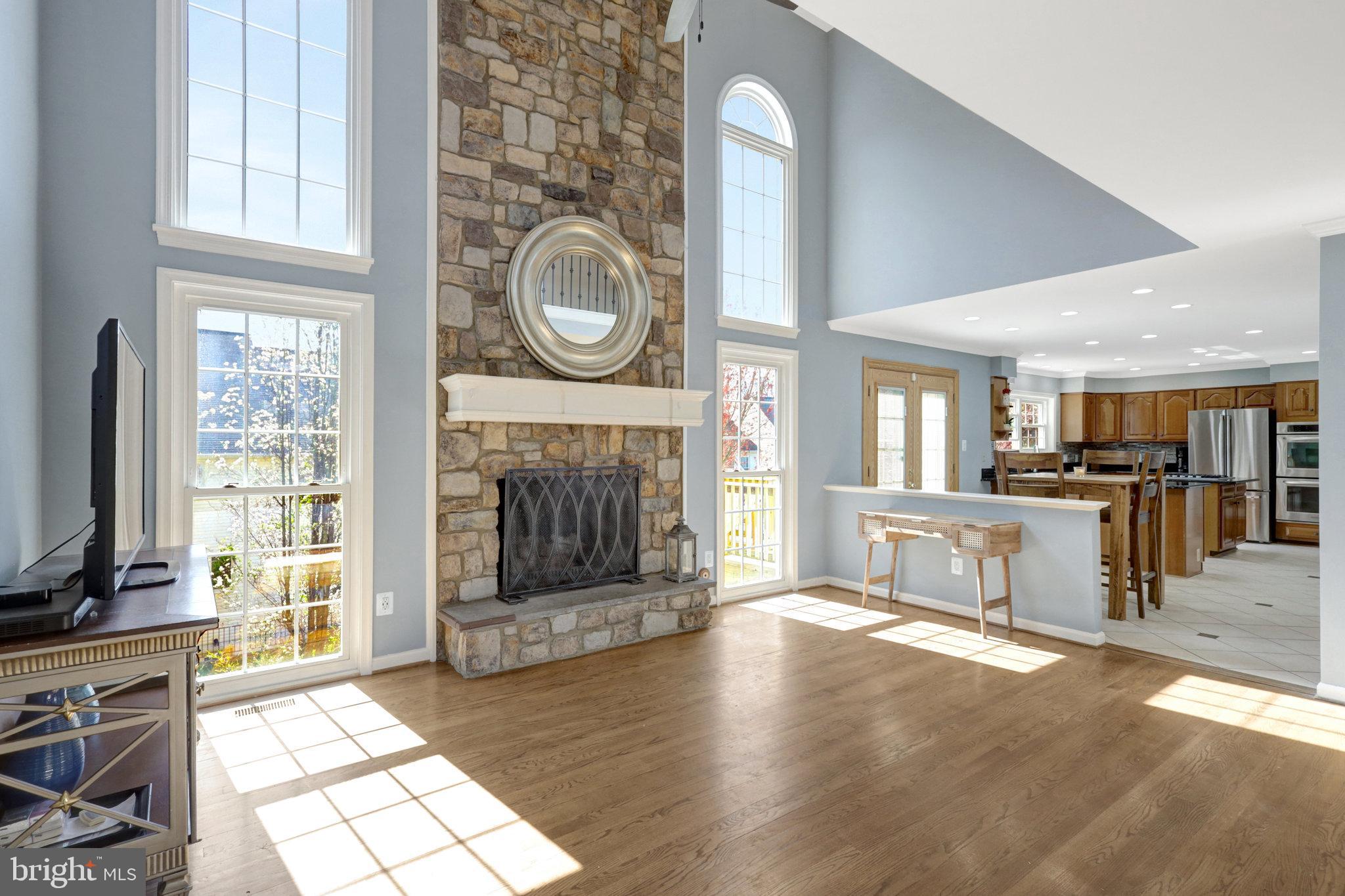 8497 Silverview Drive Lorton, VA 22079 - Photo 11 of 50 a view of a livingroom with kitchen and fireplace
