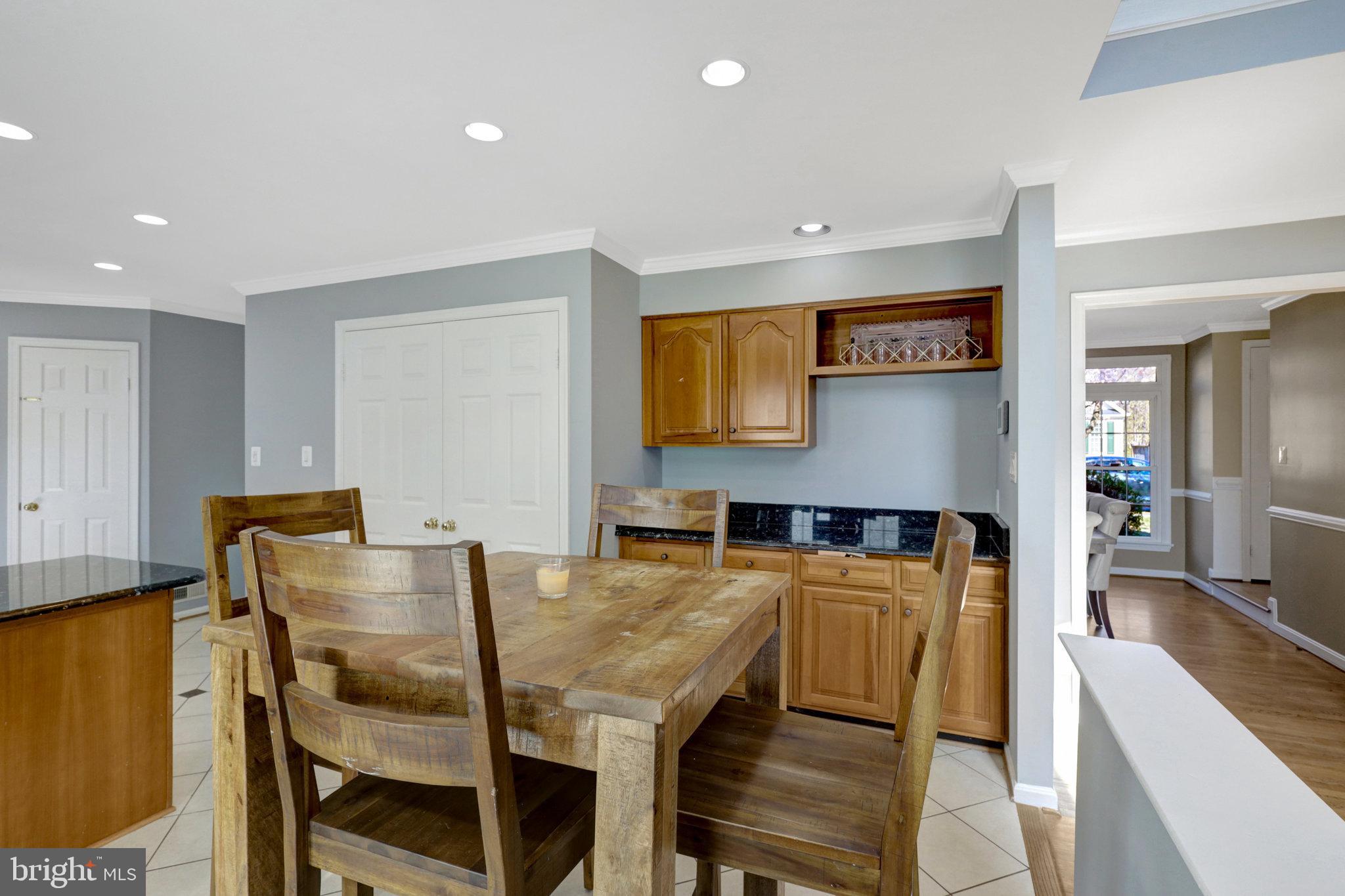 8497 Silverview Drive Lorton, VA 22079 - Photo 15 of 50 a view of a dining room with furniture and wooden floor