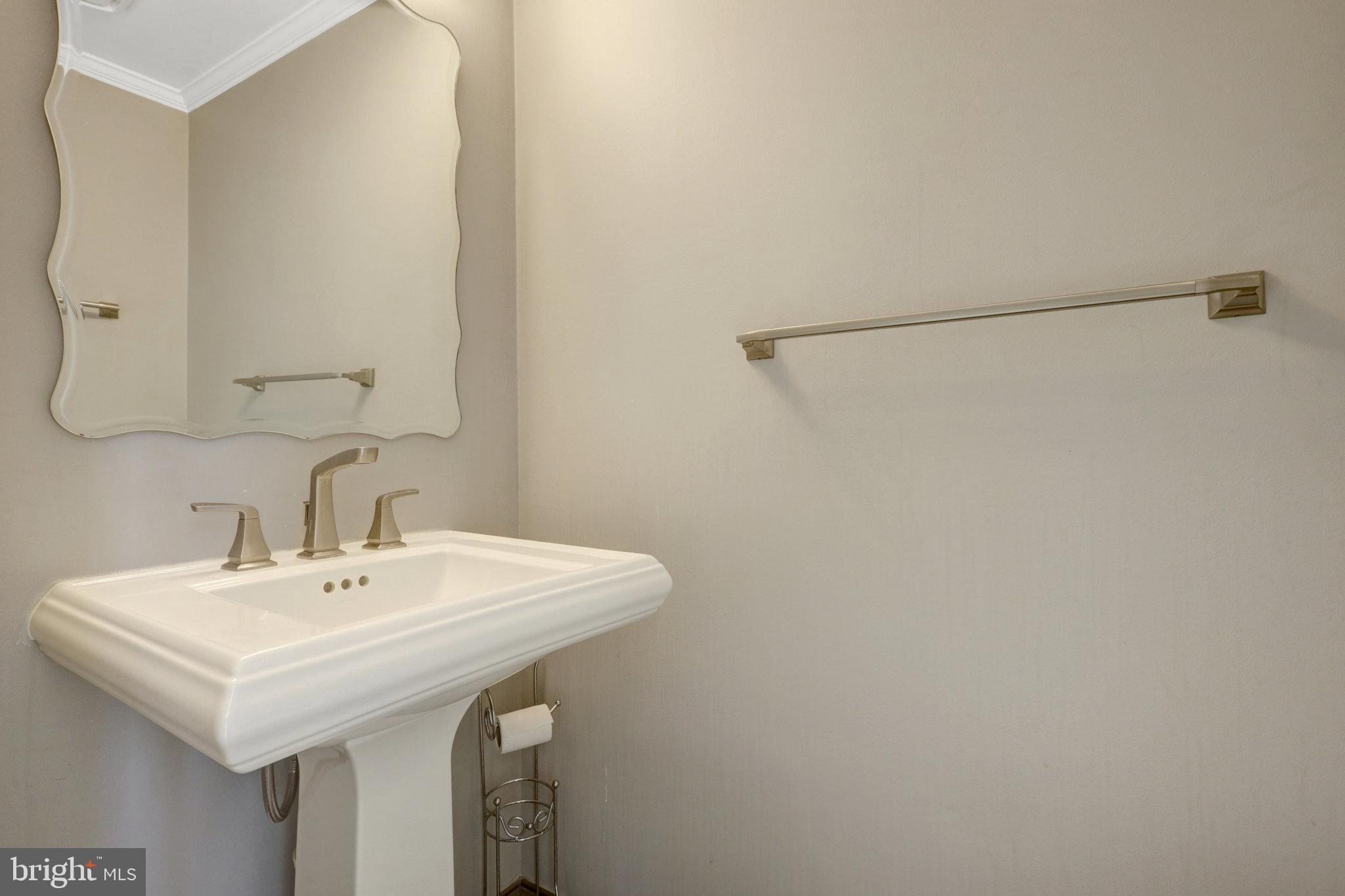 8497 Silverview Drive Lorton, VA 22079 - Photo 20 of 50 a bathroom with a sink and a mirror