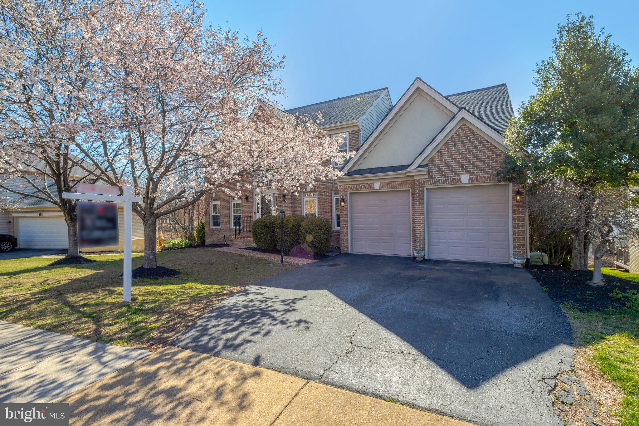 8497 Silverview Drive Lorton, VA 22079 - Photo 2 of 50 a front view of a house with a yard and garage