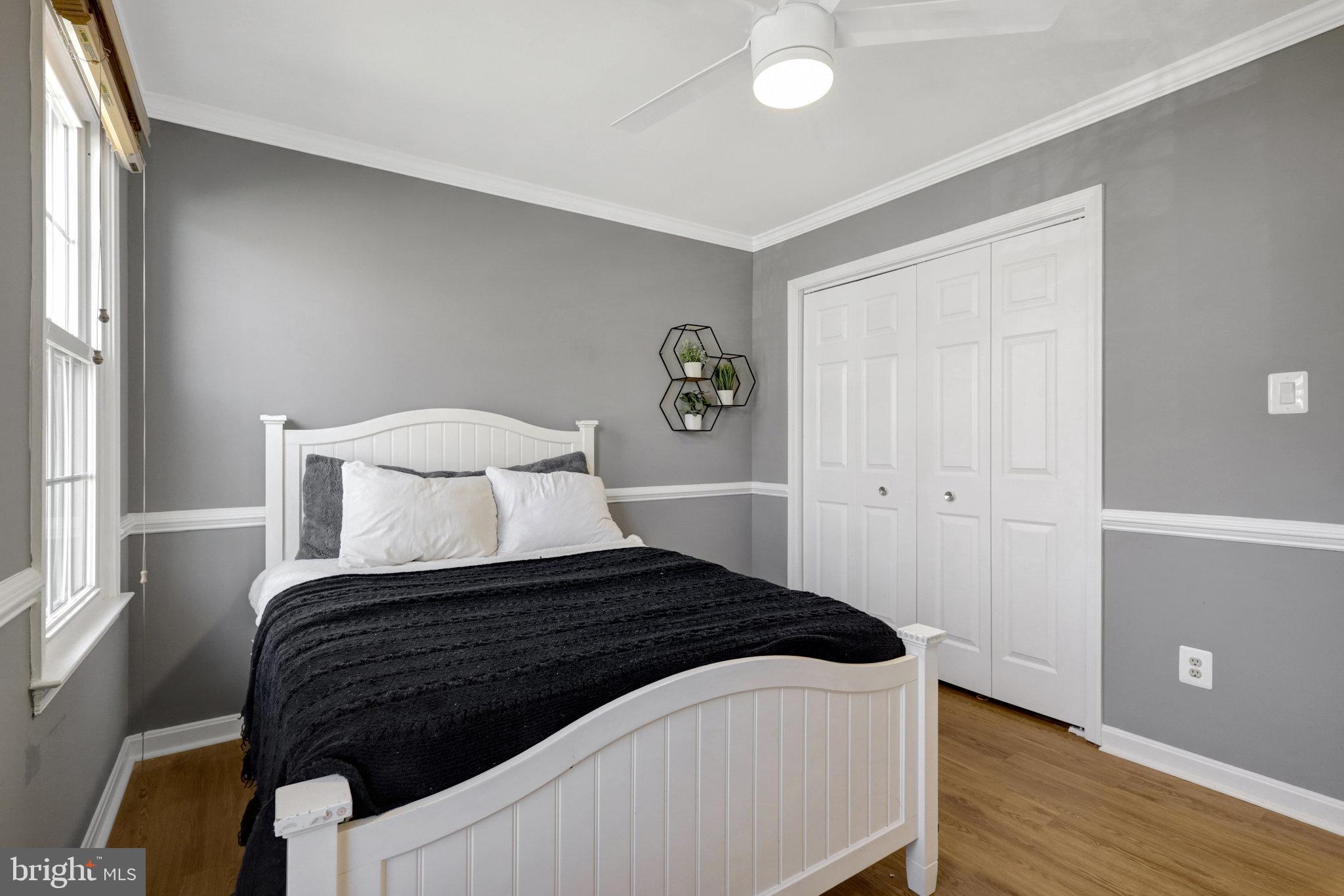 8497 Silverview Drive Lorton, VA 22079 - Photo 25 of 50 a bedroom with a bed and wooden floor