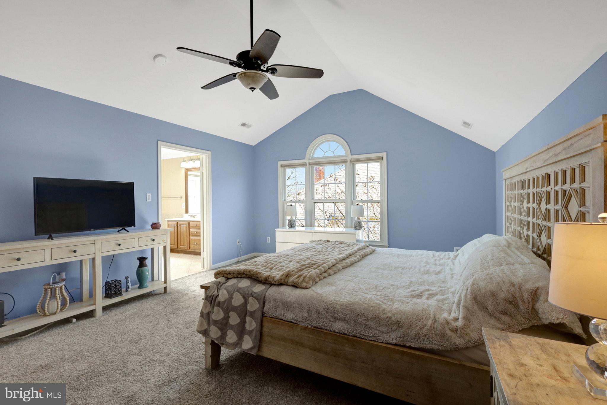 8497 Silverview Drive Lorton, VA 22079 - Photo 31 of 50 a bedroom with a bed and a flat screen tv