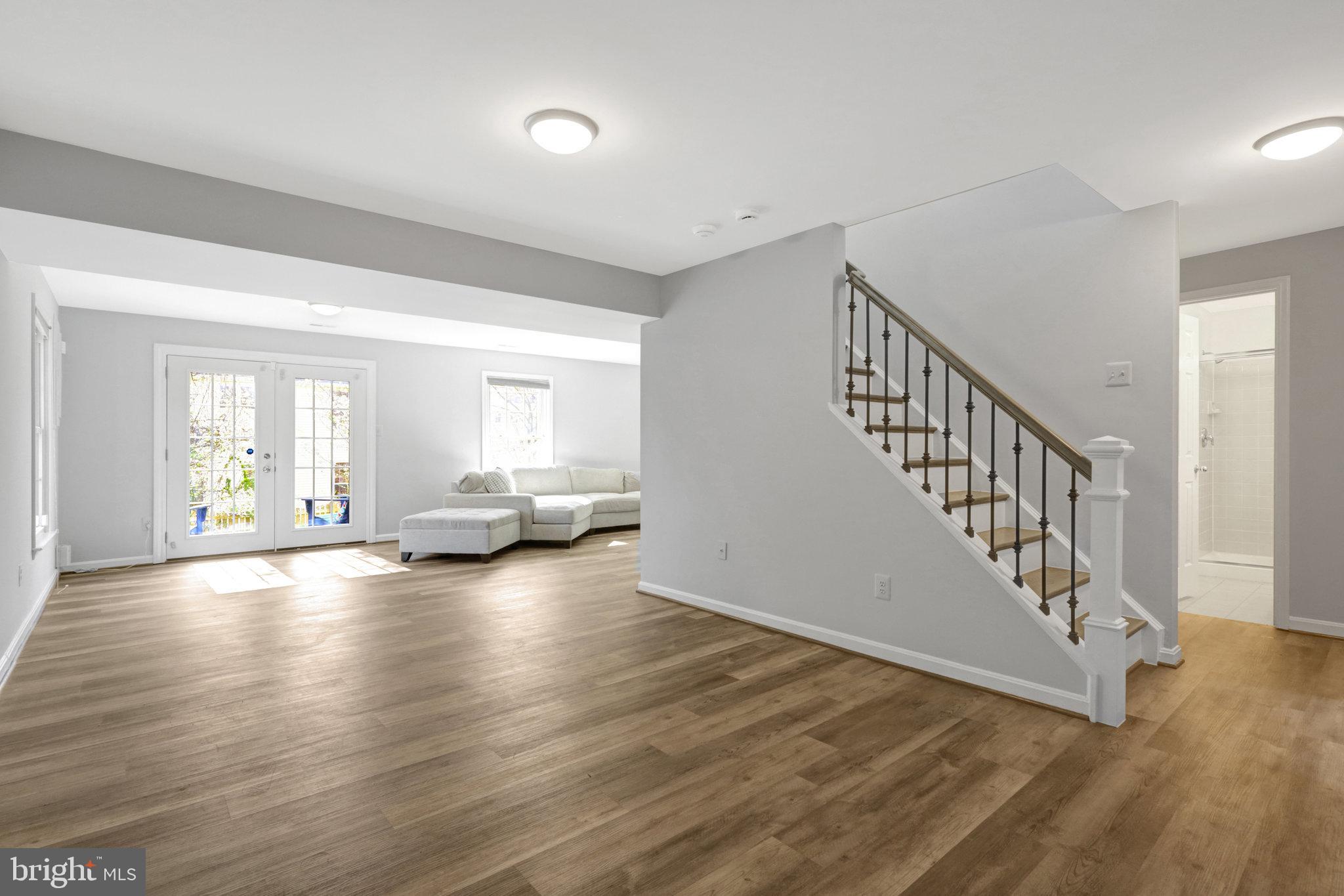 8497 Silverview Drive Lorton, VA 22079 - Photo 36 of 50 a view of an empty room with wooden floor and windows
