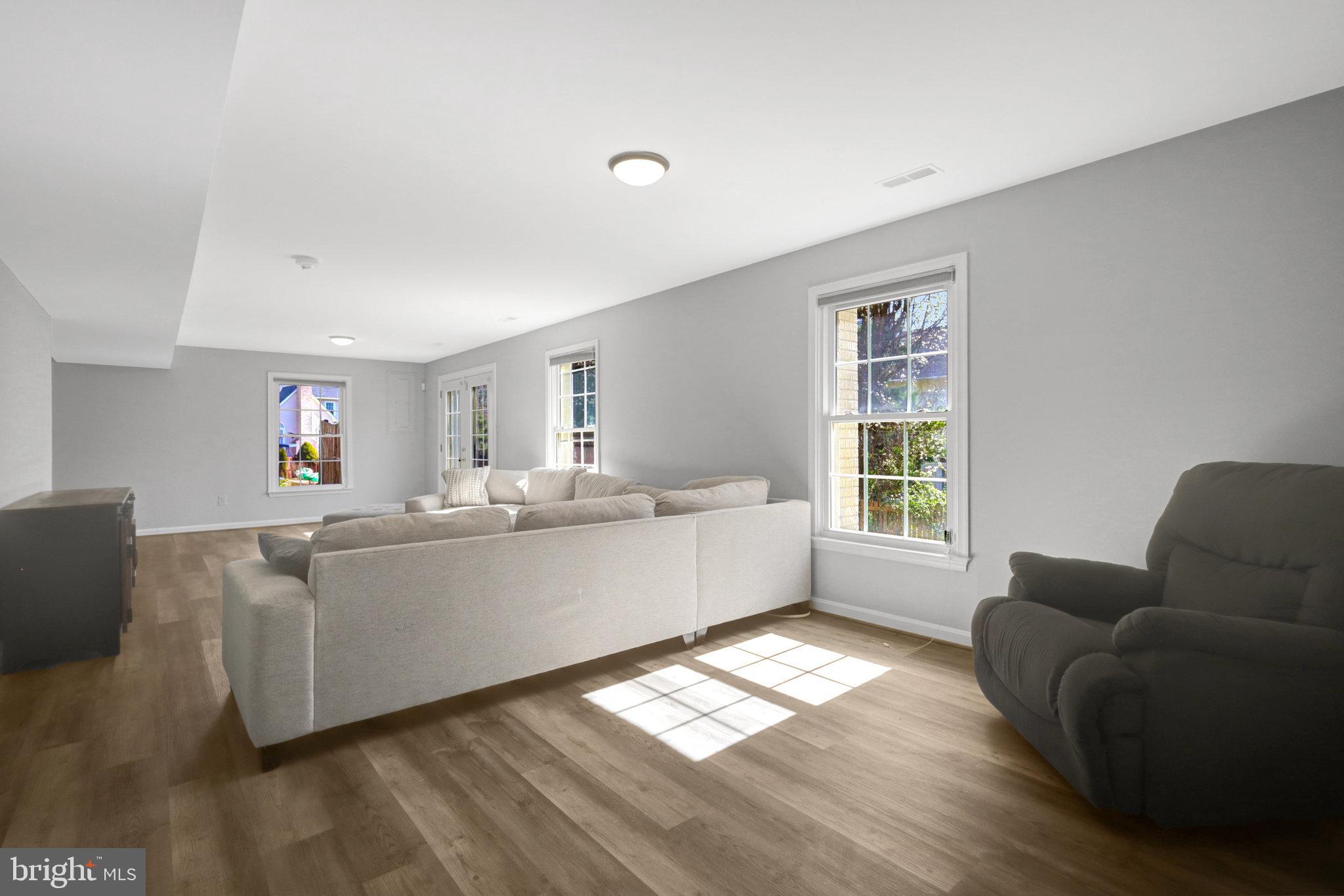 8497 Silverview Drive Lorton, VA 22079 - Photo 38 of 50 a living room with furniture and windows