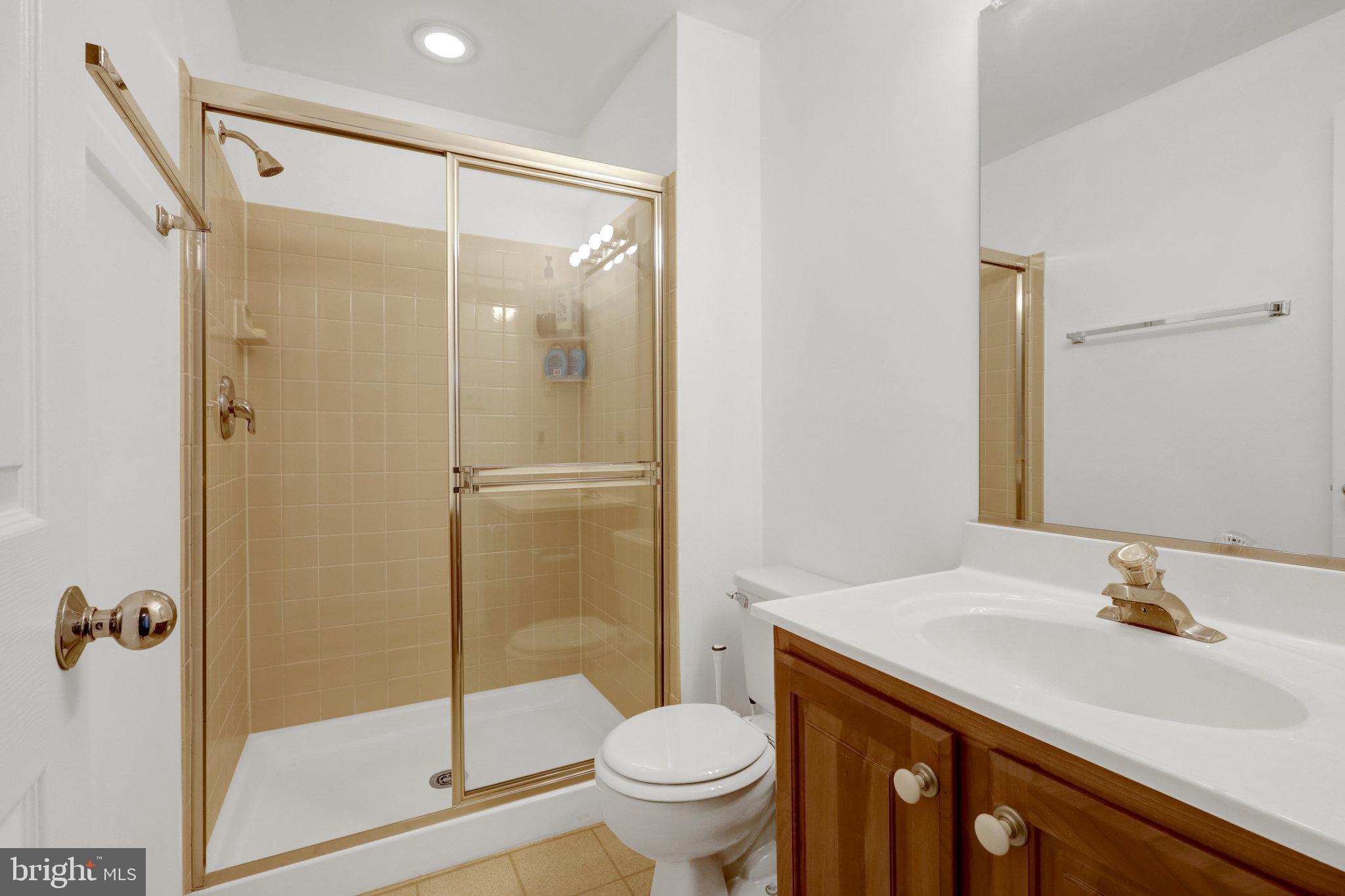 8497 Silverview Drive Lorton, VA 22079 - Photo 39 of 50 a bathroom with a sink toilet and shower