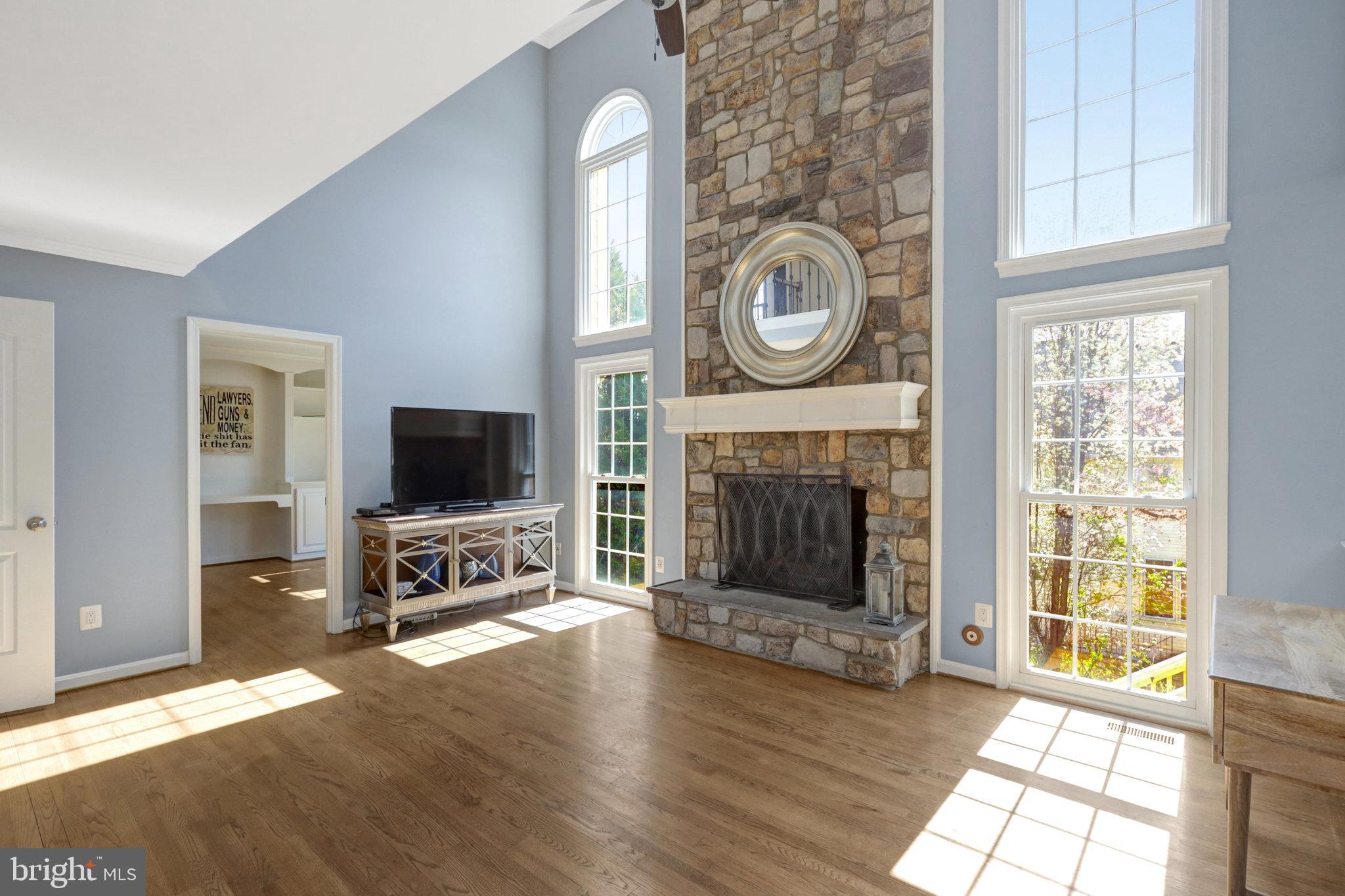 8497 Silverview Drive Lorton, VA 22079 - Photo 41 of 50 a living room with furniture a flat screen tv and a fireplace