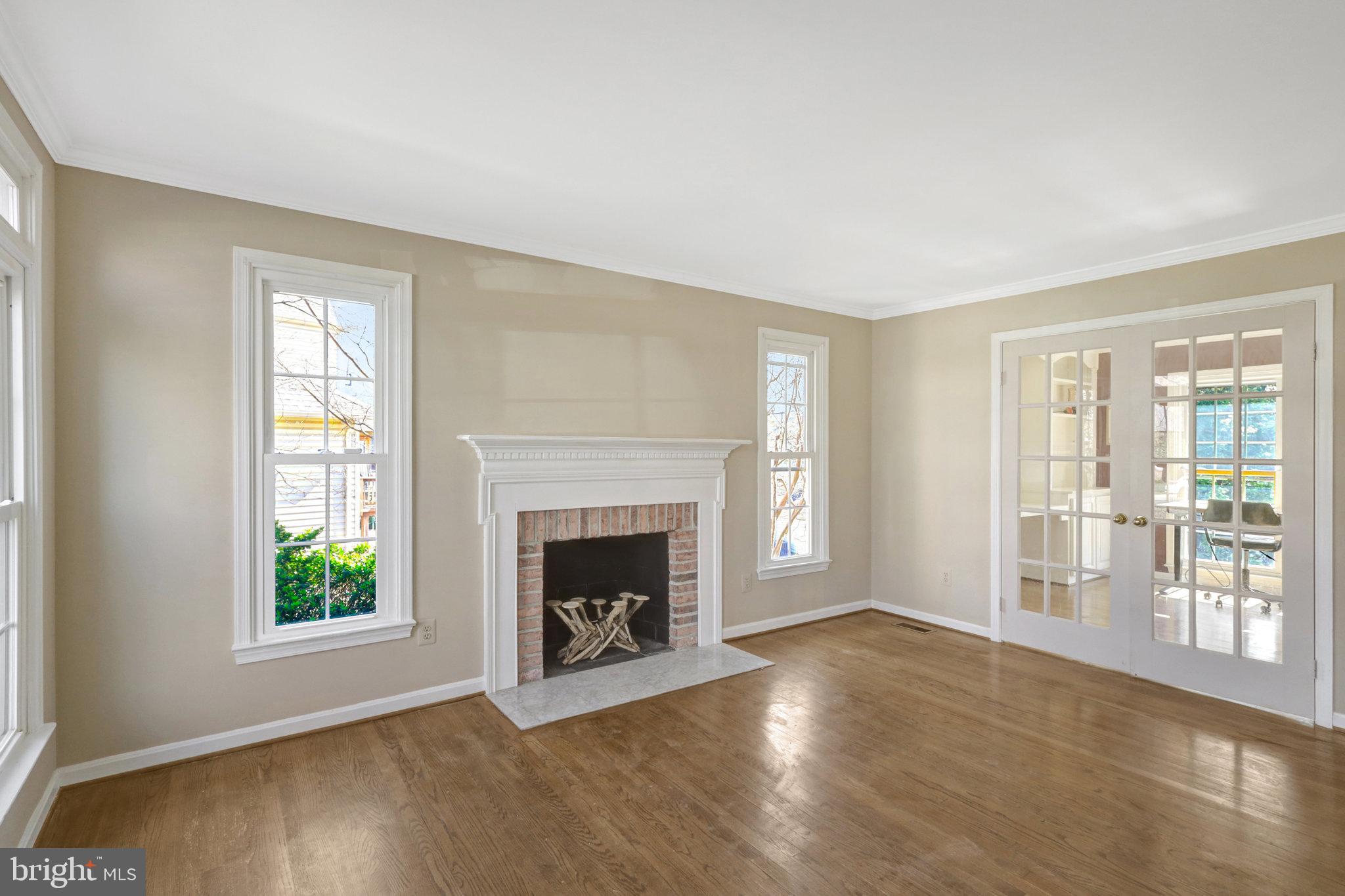 8497 Silverview Drive Lorton, VA 22079 - Photo 43 of 50 an empty room with windows and fireplace
