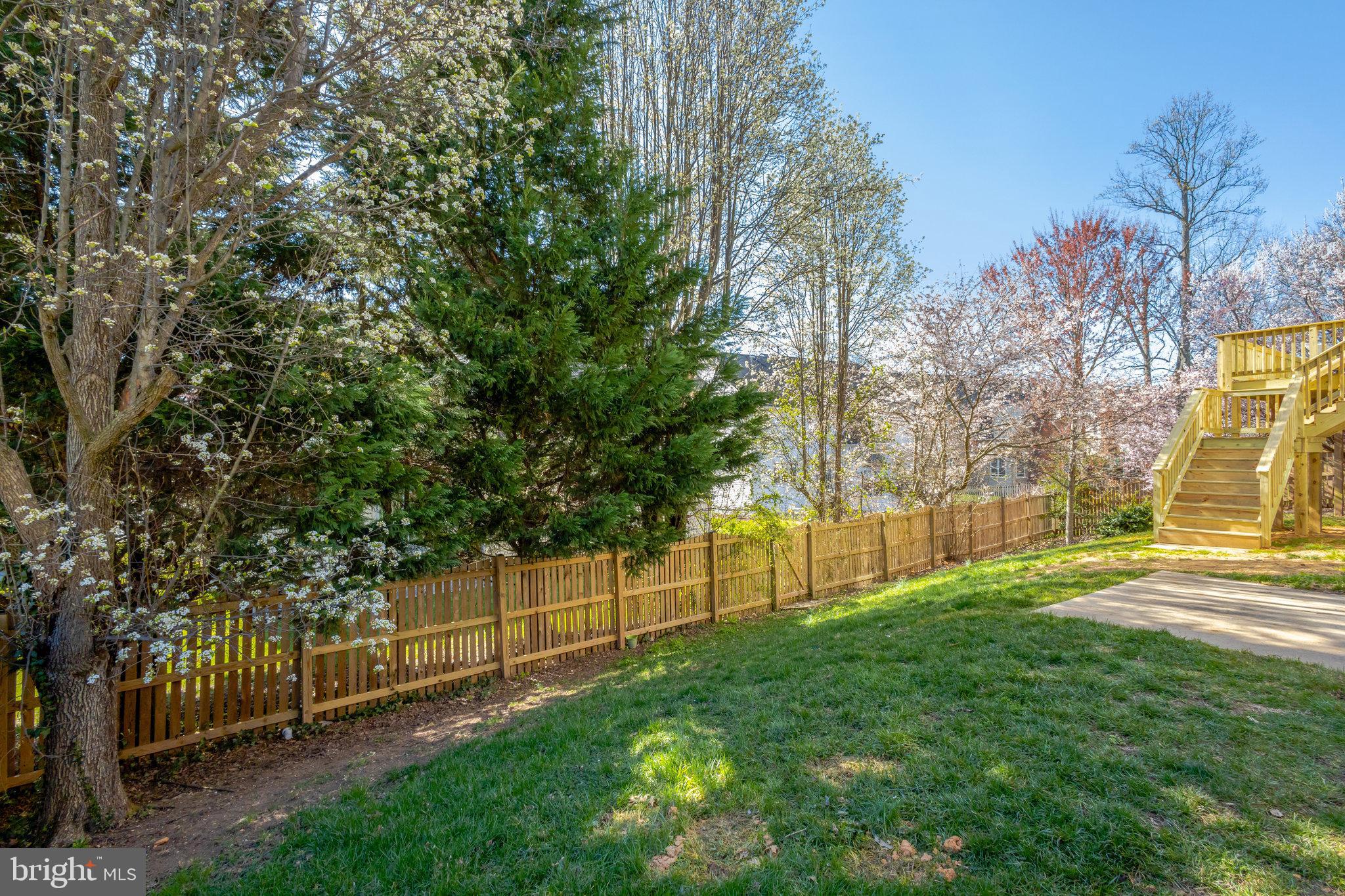 8497 Silverview Drive Lorton, VA 22079 - Photo 47 of 50 a view of a backyard with wooden fence