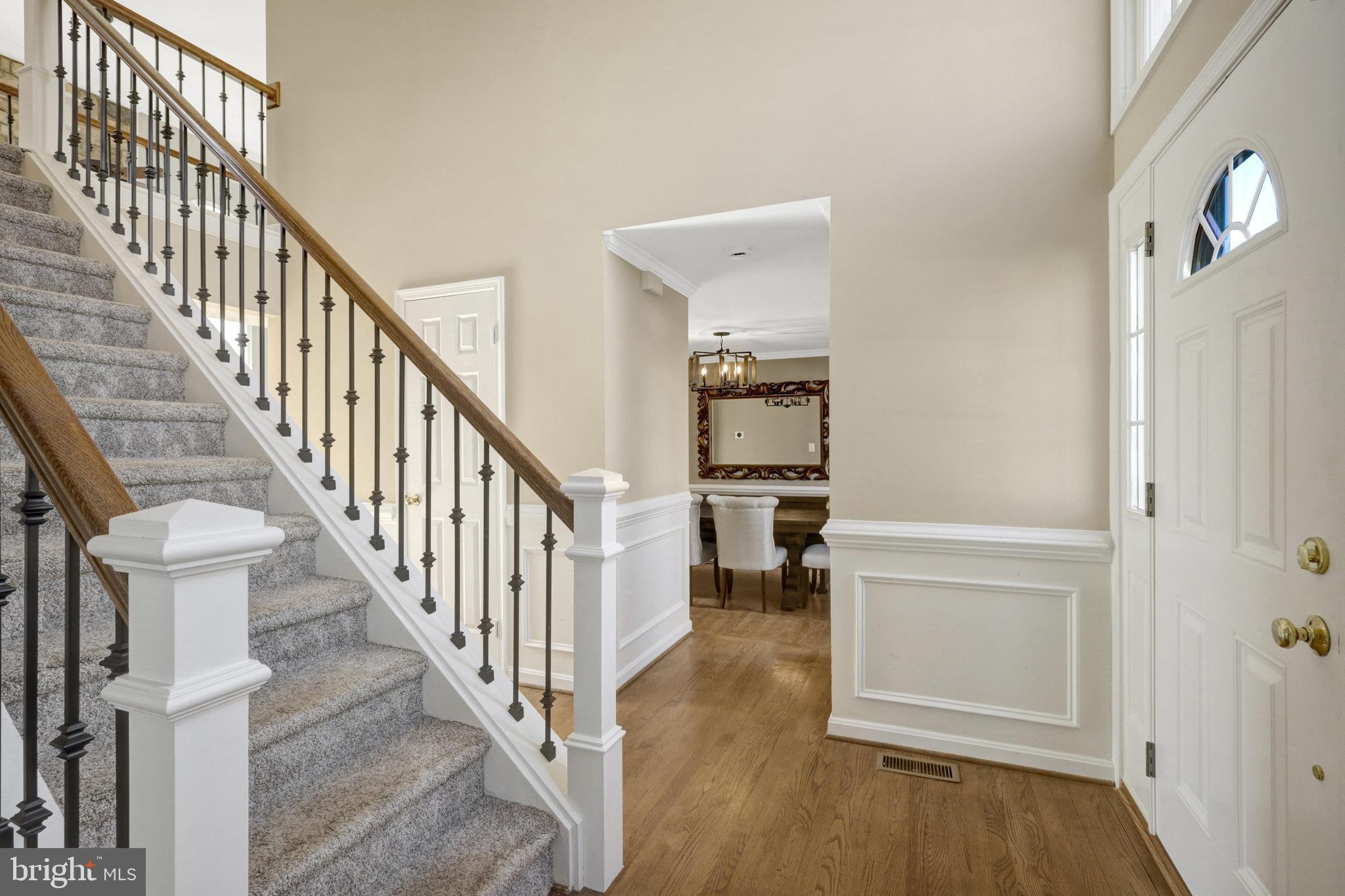 8497 Silverview Drive Lorton, VA 22079 - Photo 6 of 50 a view of entryway and hall with wooden floor