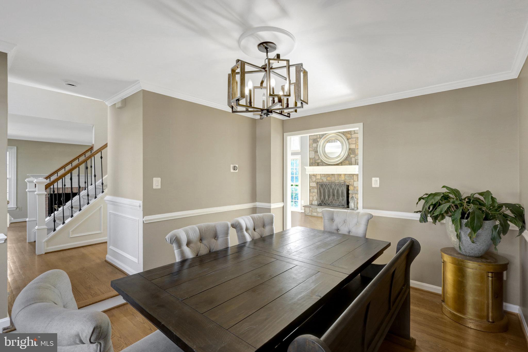 8497 Silverview Drive Lorton, VA 22079 - Photo 9 of 50 a view of a dining room with furniture window and wooden floor