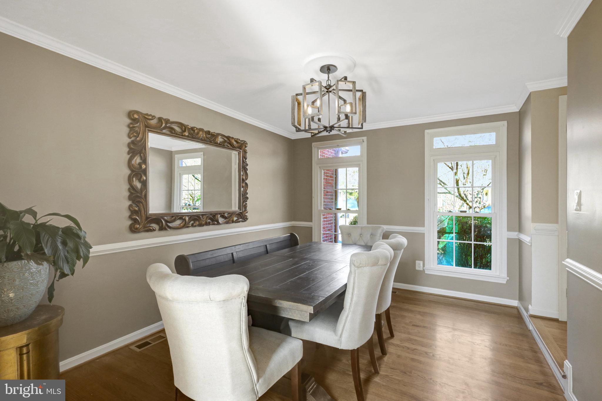 8497 Silverview Drive Lorton, VA 22079 - Photo 10 of 50 a view of a dining room with furniture window and wooden floor
