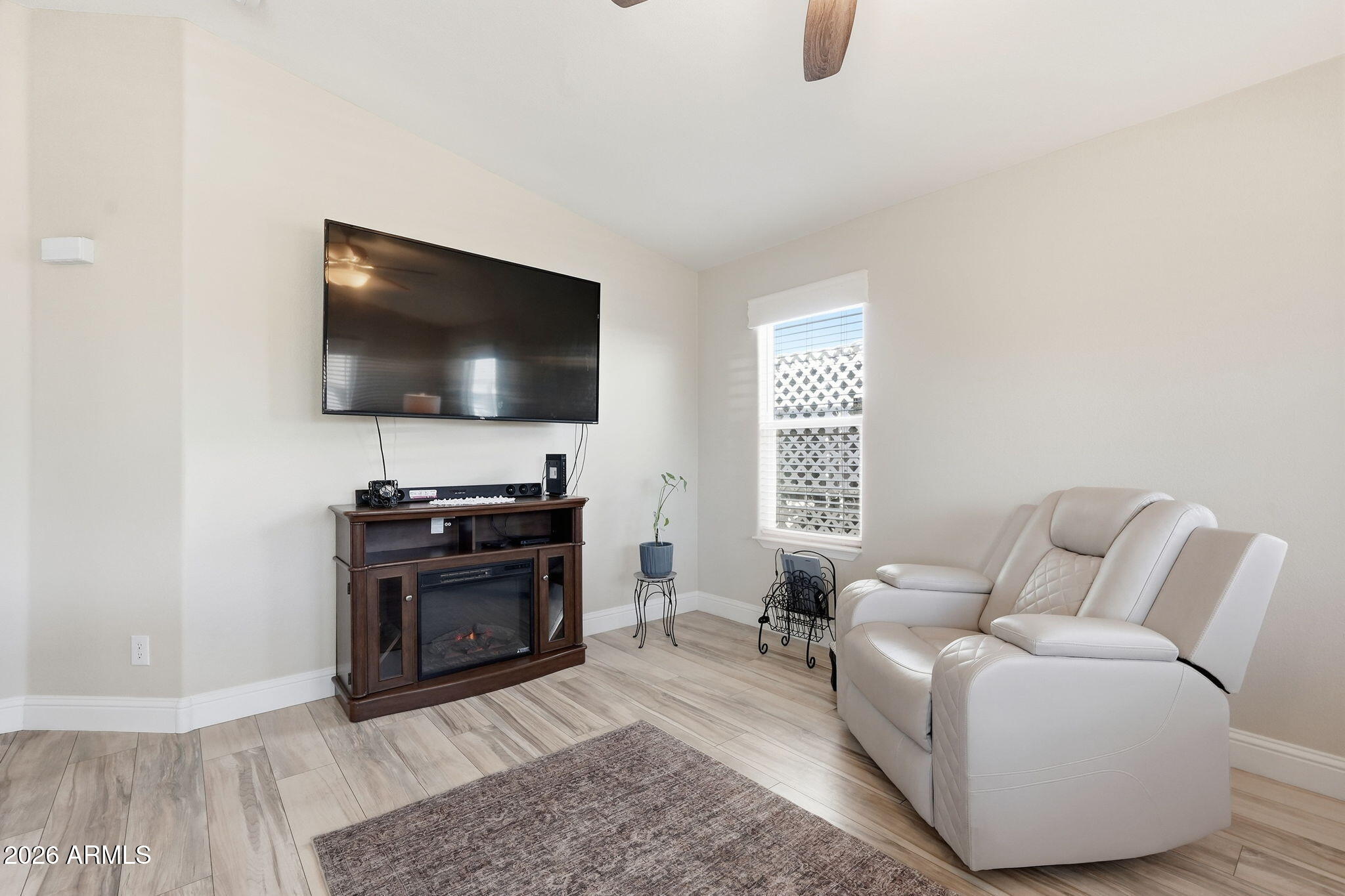 8865 East Baseline Road, Unit 1417 Mesa, AZ 85209 - Photo 10 of 47 a living room with furniture and a flat screen tv