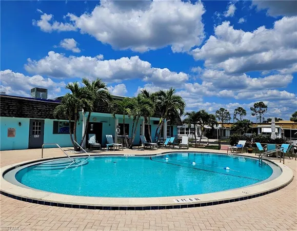 a view of a swimming pool with a patio