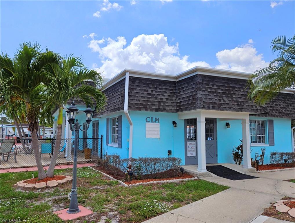 71 Sturbridge Lane Fort Myers, FL 33908 - Photo 4 of 14 a front view of a house with garden