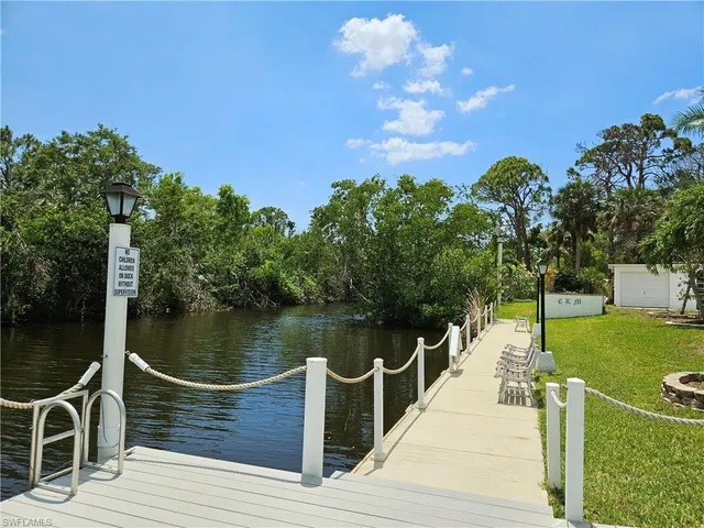a wooden deck with a lake view