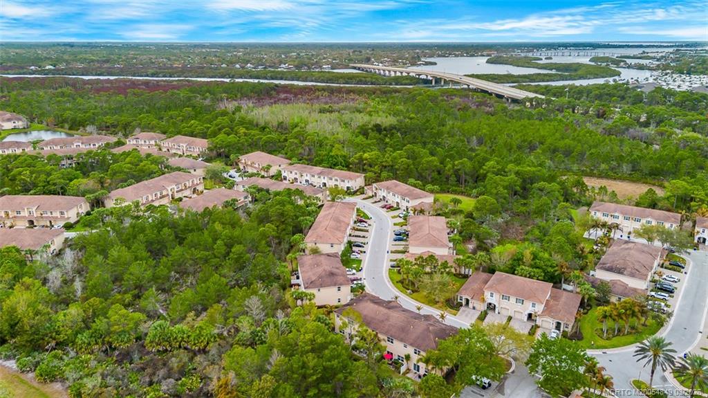 325 Southwest Otter Run Place Stuart, FL 34997 - Photo 2 of 2 an aerial view of a house with a yard