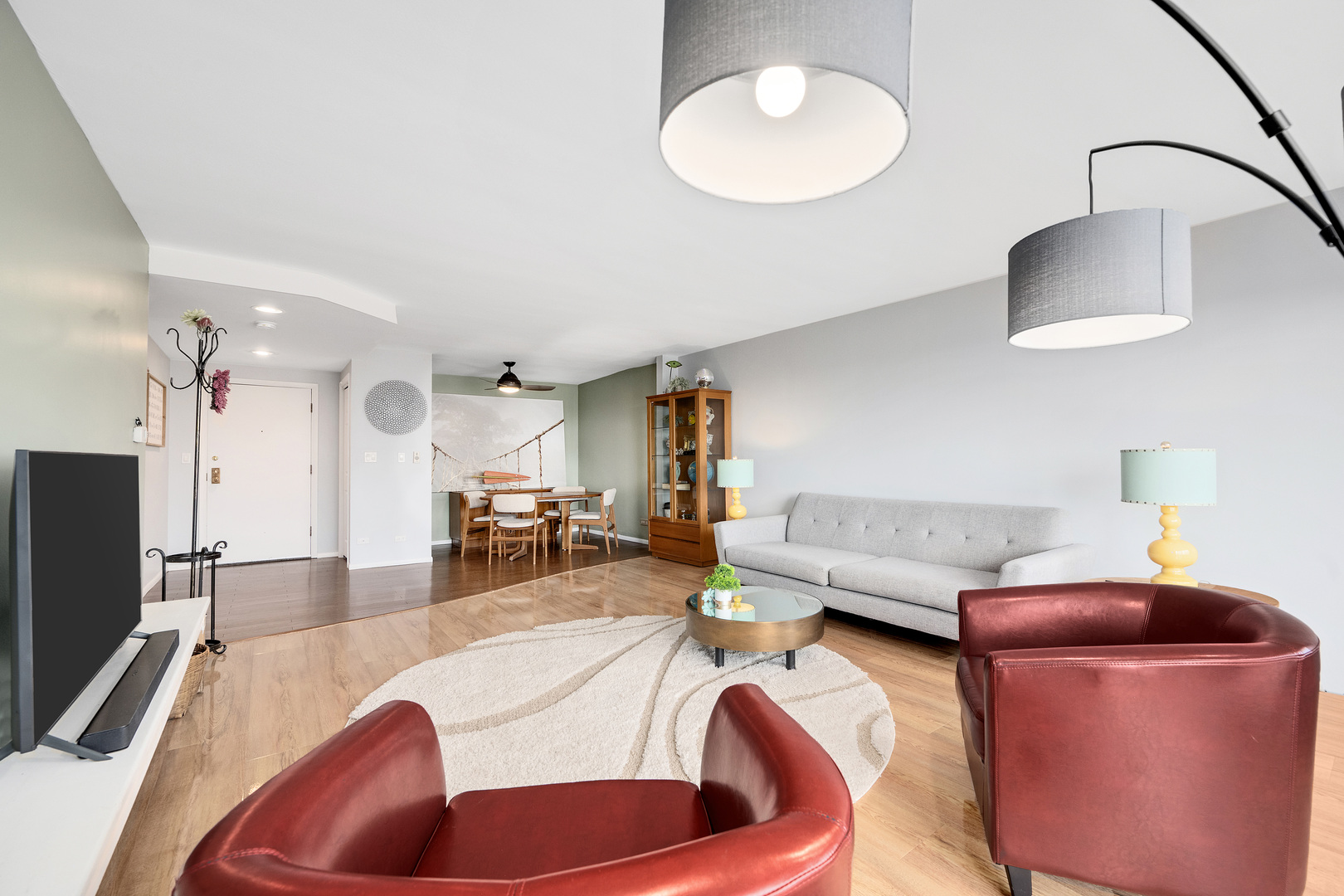 2000 St Regis Drive, Unit 6B Lombard, IL 60148 - Photo 11 of 32 a living room with furniture and a flat screen tv