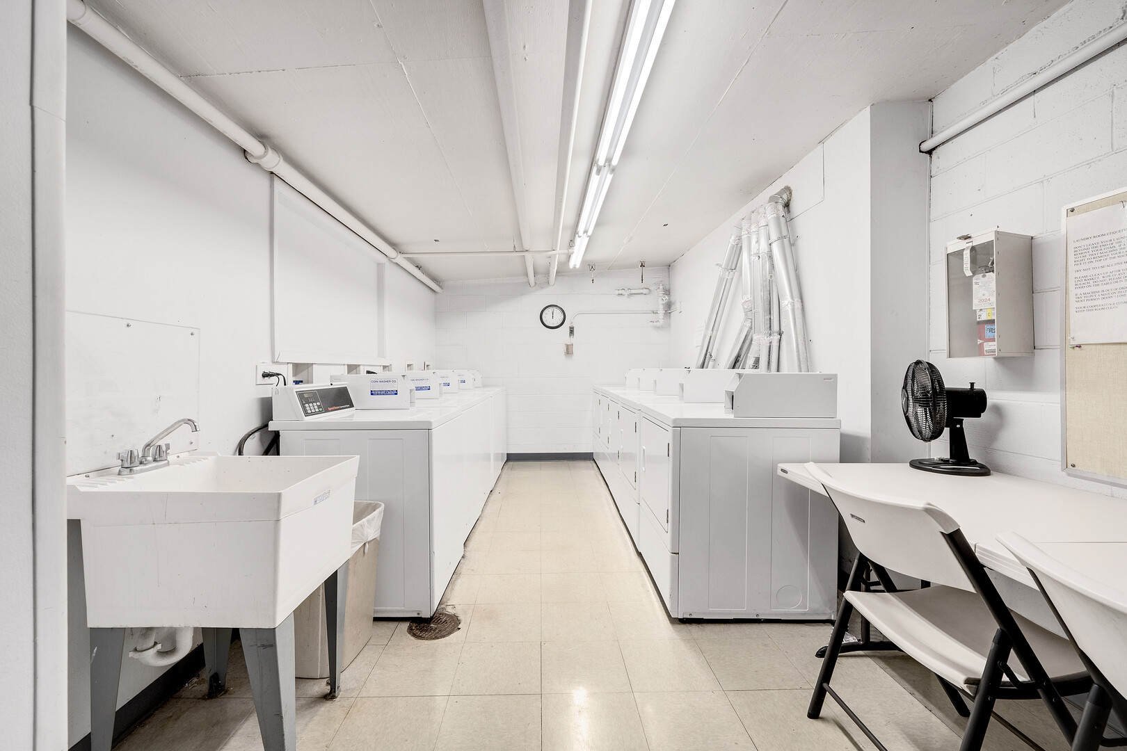 2000 St Regis Drive, Unit 6B Lombard, IL 60148 - Photo 21 of 32 a kitchen with a sink a white appliances and cabinets