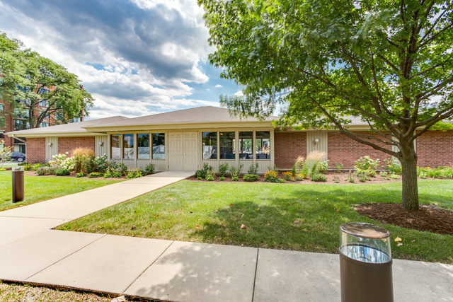 2000 St Regis Drive, Unit 6B Lombard, IL 60148 - Photo 22 of 32 front view of a house with a yard