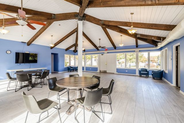 2000 St Regis Drive, Unit 6B Lombard, IL 60148 - Photo 23 of 32 a view of a dining room with furniture window and outside view