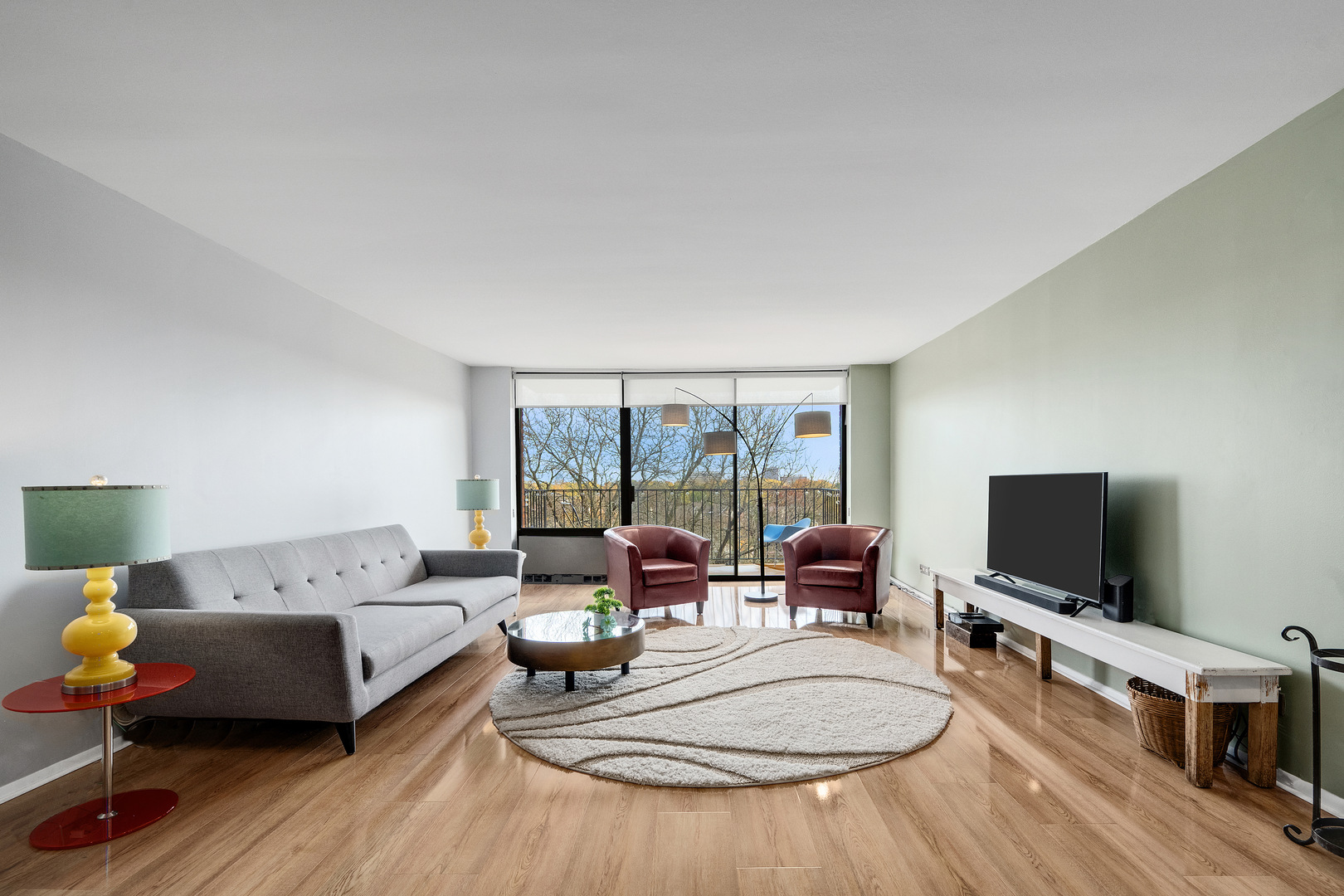 2000 St Regis Drive, Unit 6B Lombard, IL 60148 - Photo 9 of 32 a living room with furniture and a flat screen tv