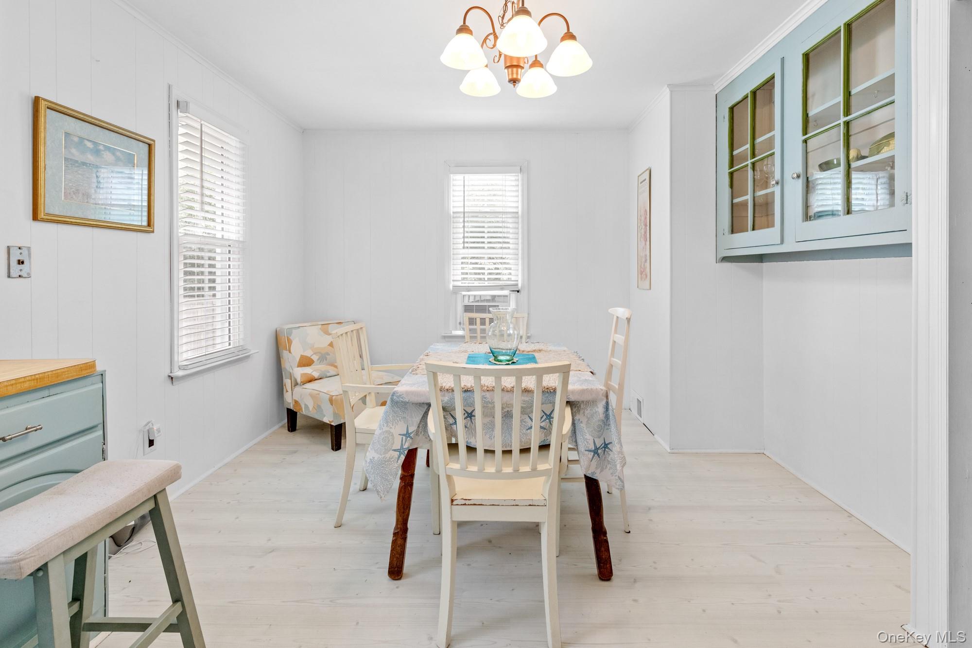 64 Point Street South Jamesport, NY 11970 - Photo 14 of 29 a dining room with furniture and window