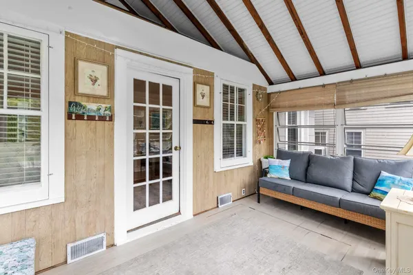 a living room with furniture and a window