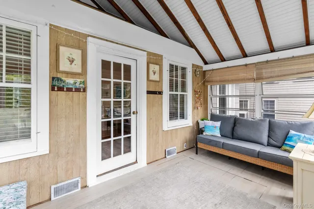 a living room with furniture and a window