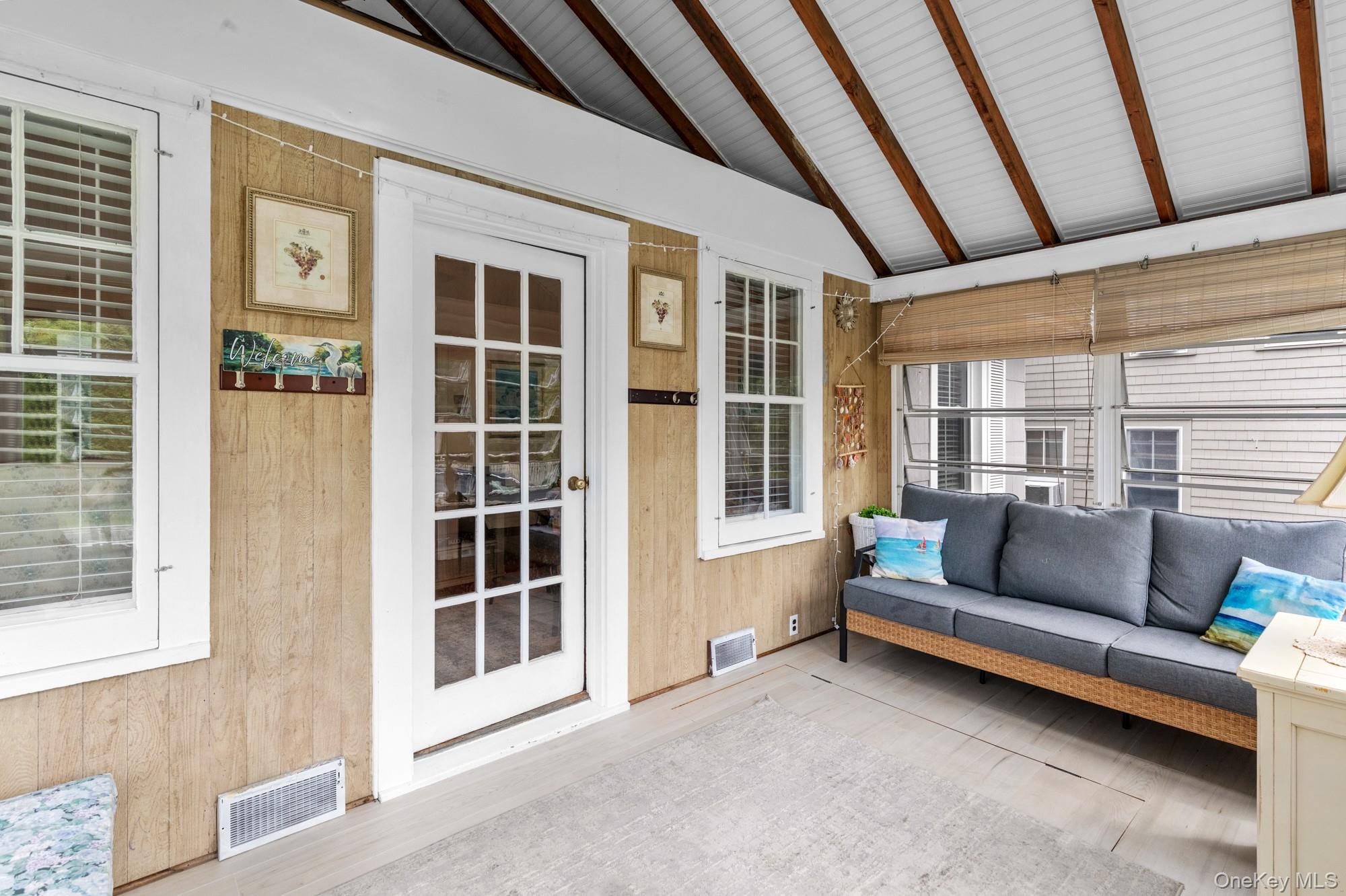 64 Point Street South Jamesport, NY 11970 - Photo 3 of 29 a living room with furniture and a window