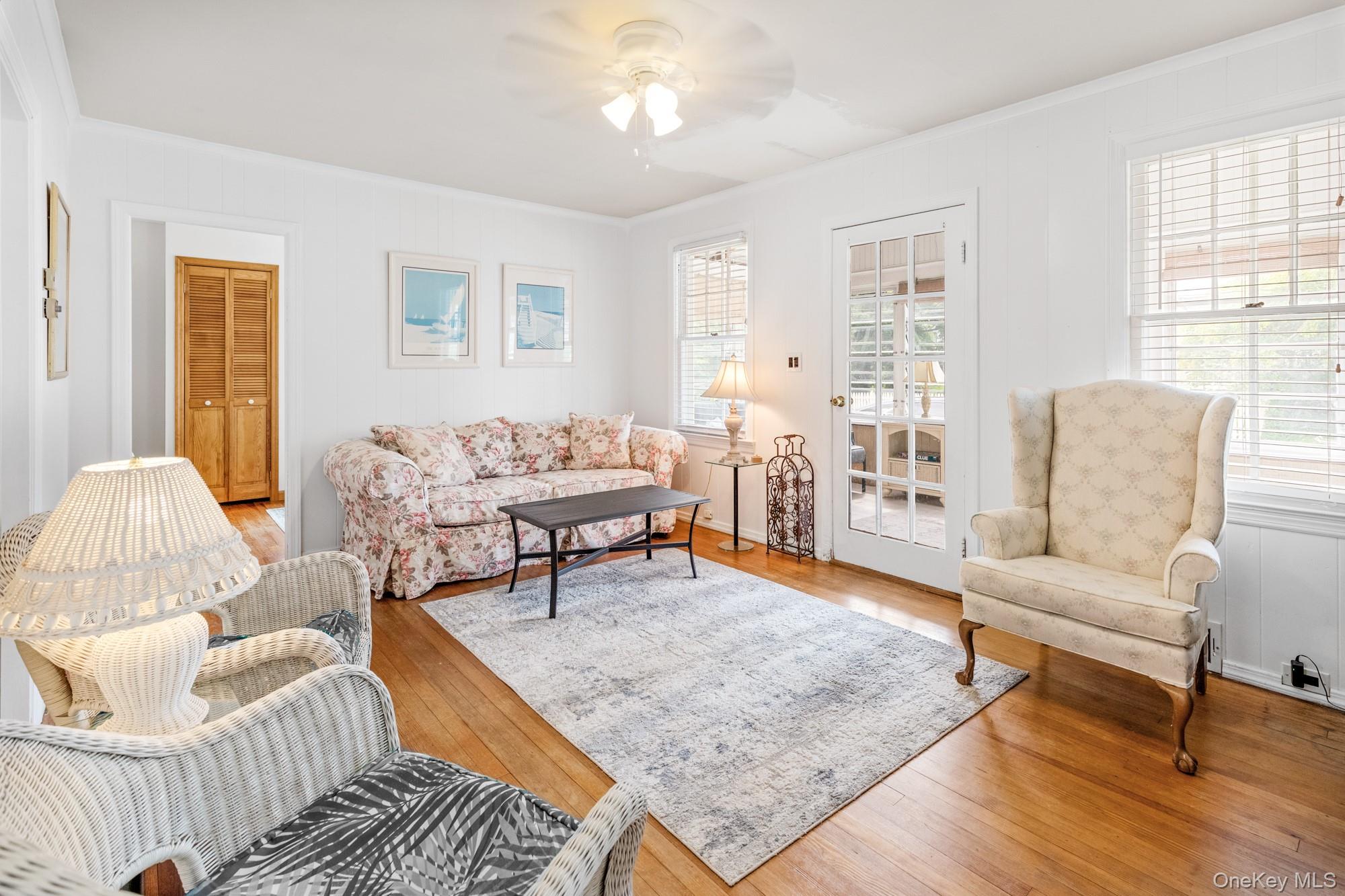 64 Point Street South Jamesport, NY 11970 - Photo 7 of 29 a living room with furniture and a table