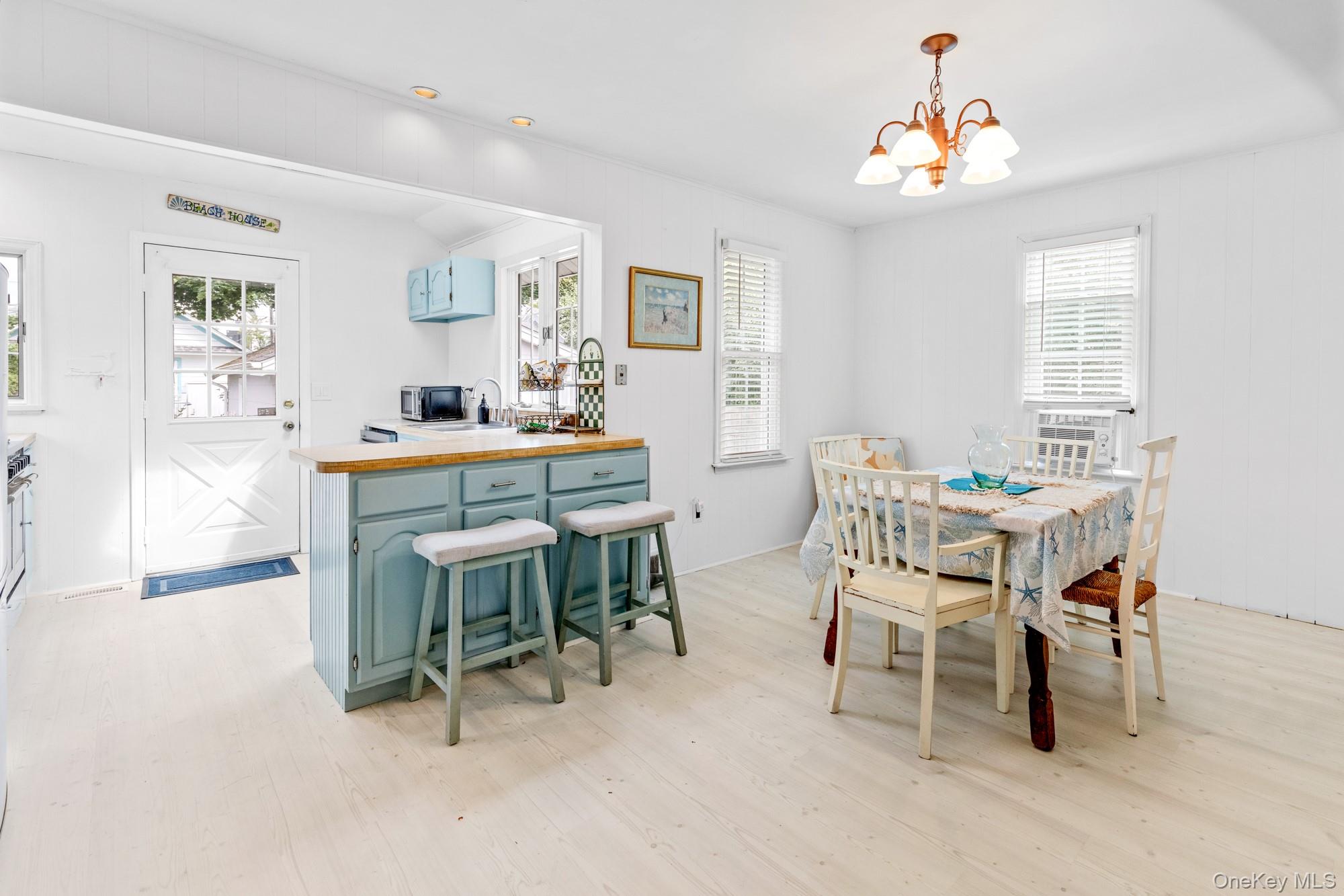 64 Point Street South Jamesport, NY 11970 - Photo 9 of 29 a dining room with furniture and window