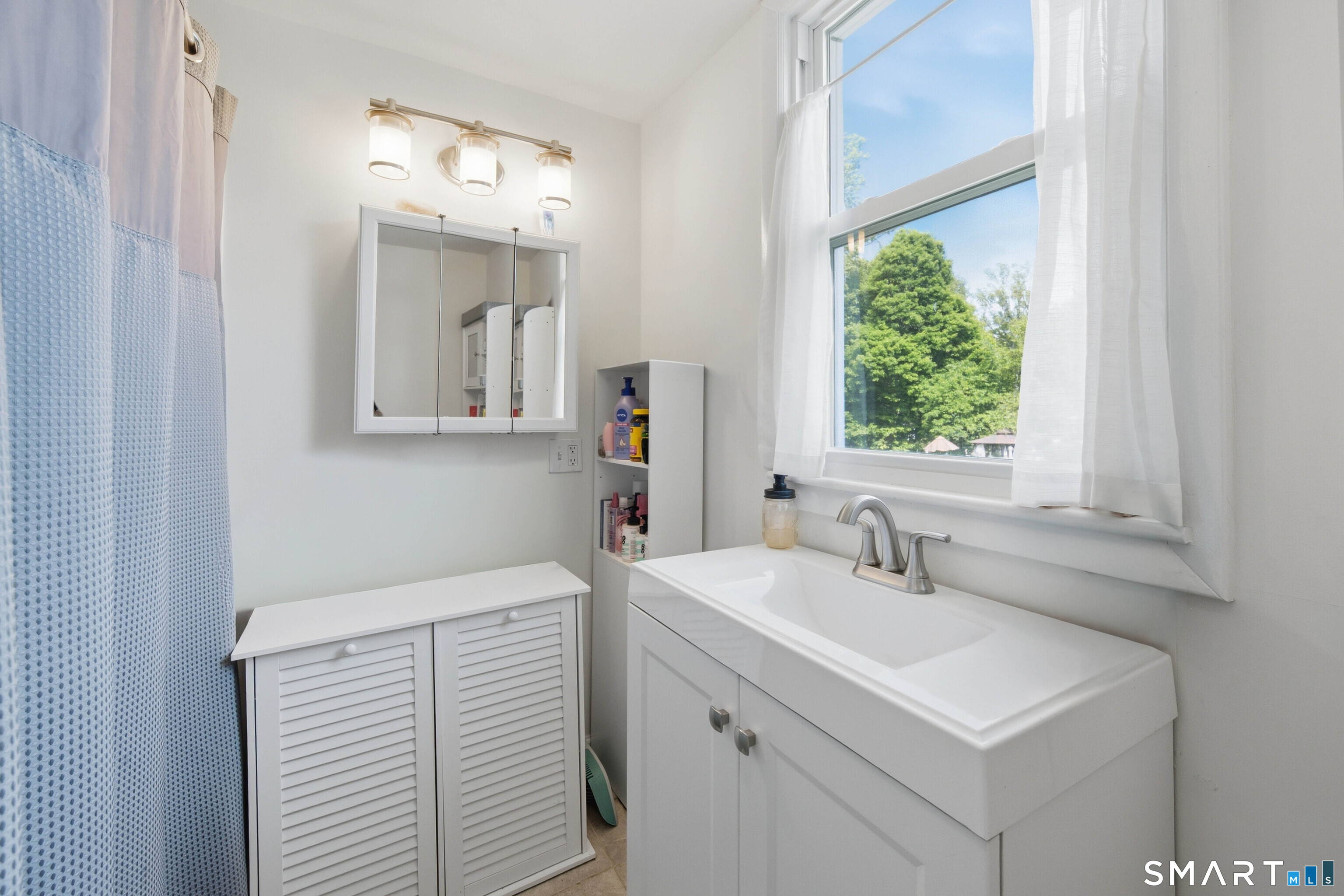 120 May Street Naugatuck, CT 06770 - Photo 15 of 31 a bathroom with a sink and a mirror