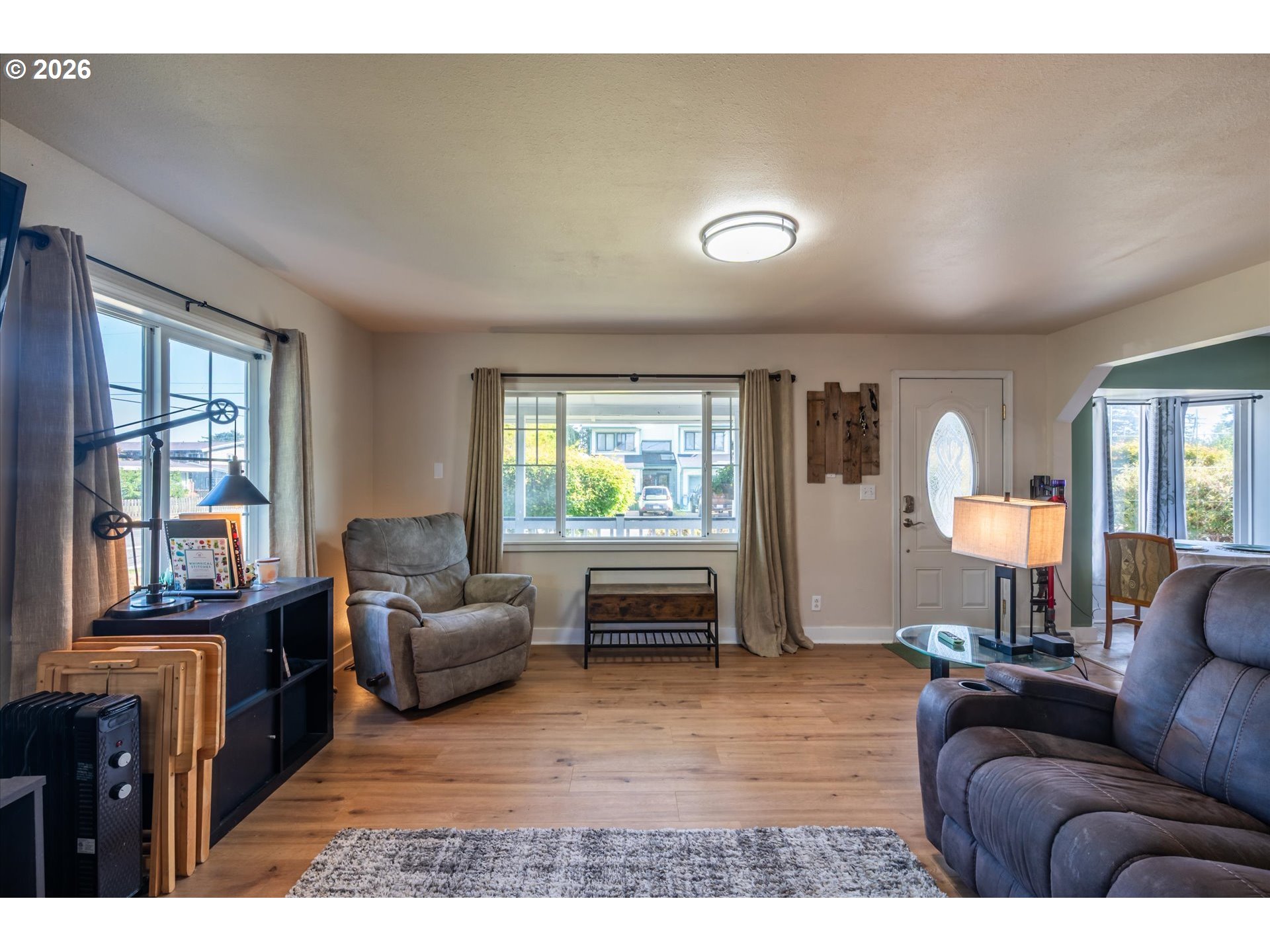 1789 14th Street North Bend, OR 97459 - Photo 10 of 43 a living room with furniture and a large window