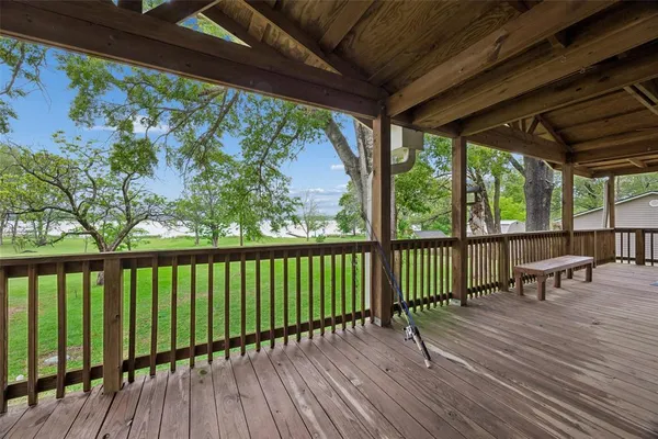 a view of balcony with wooden floor