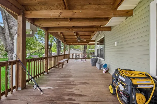 a view of a balcony with wooden floor