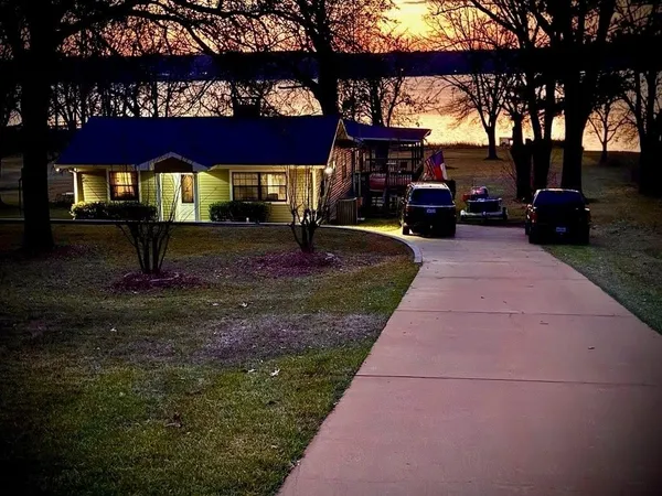 a backyard of a house with lots of green space and garden