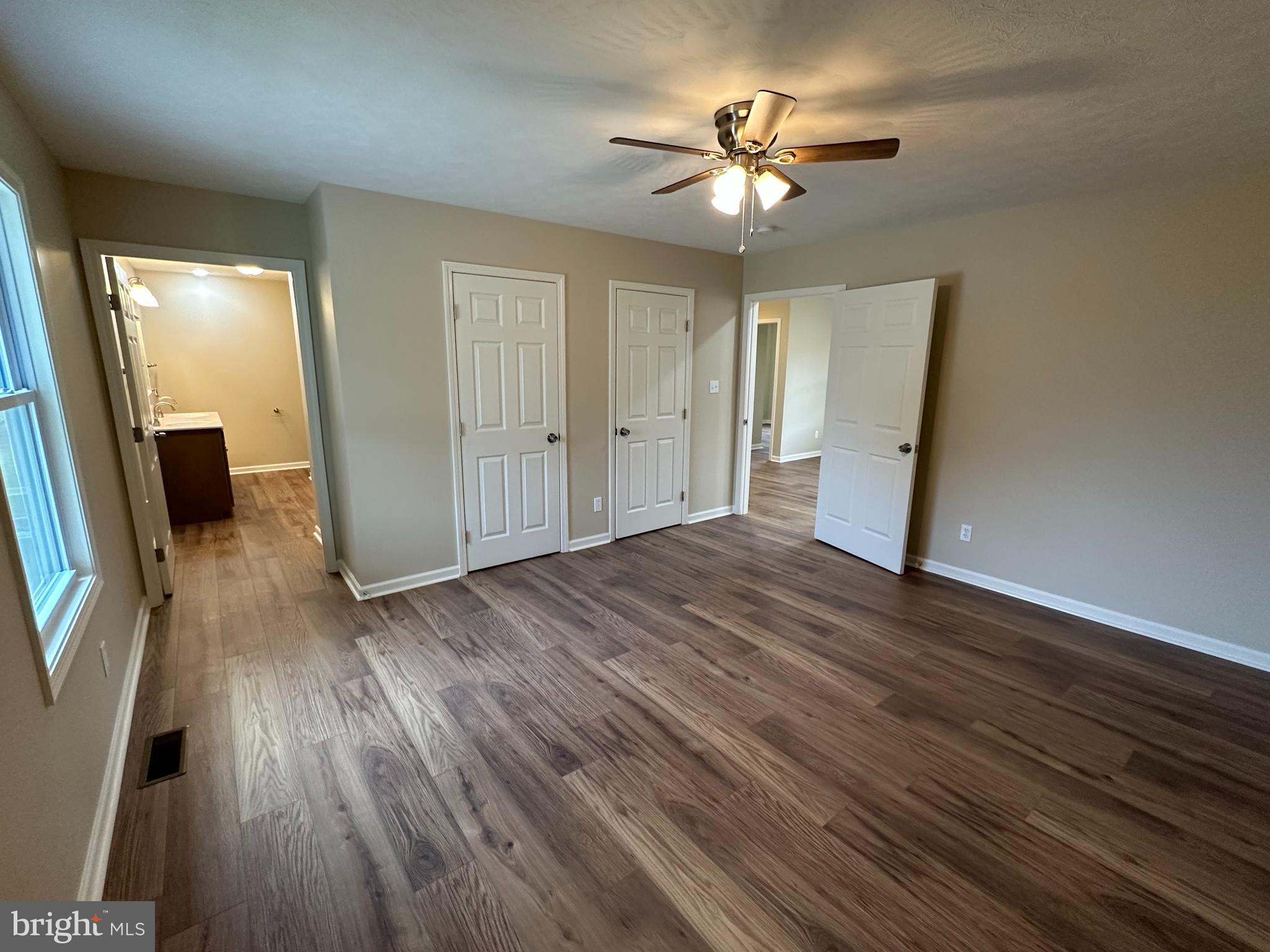 218 Honeyville Road Stanley, VA 22851 - Photo 13 of 27 wooden floor in an empty room with a mirror