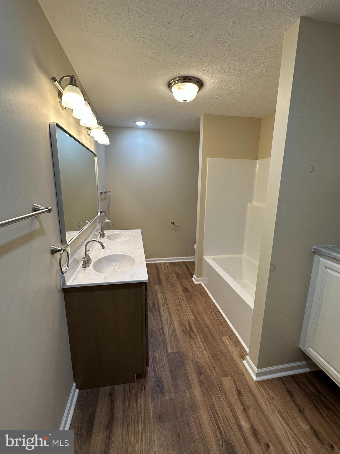 218 Honeyville Road Stanley, VA 22851 - Photo 14 of 27 a bathroom with sink shower and mirror