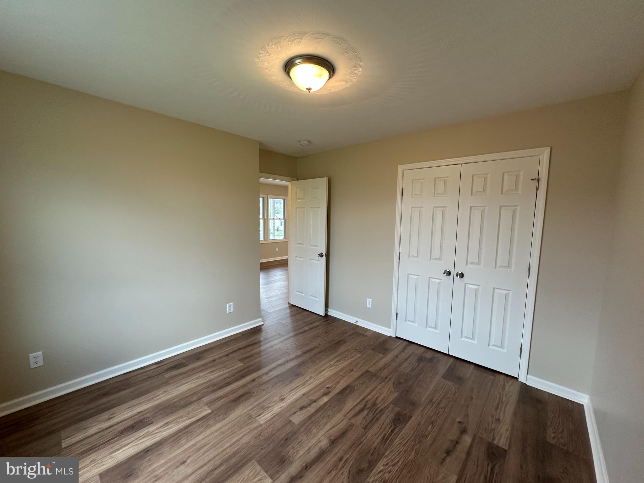 218 Honeyville Road Stanley, VA 22851 - Photo 18 of 27 a view of an empty room with wooden floor