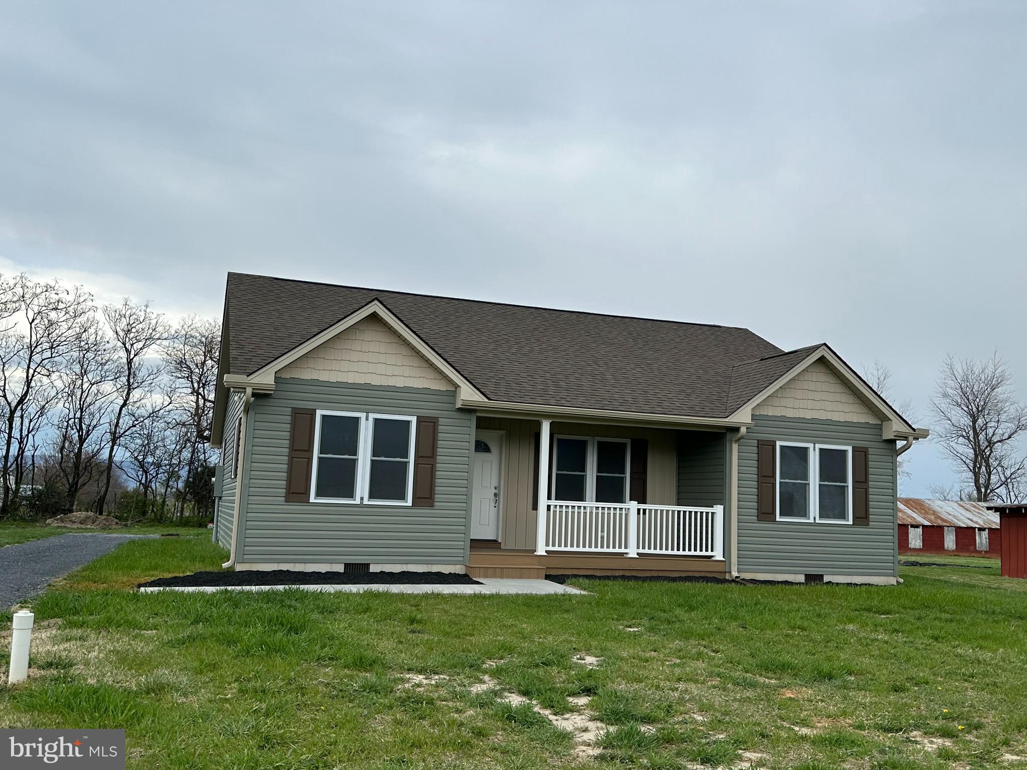 218 Honeyville Road Stanley, VA 22851 - Photo 2 of 27 a front view of a house with a garden