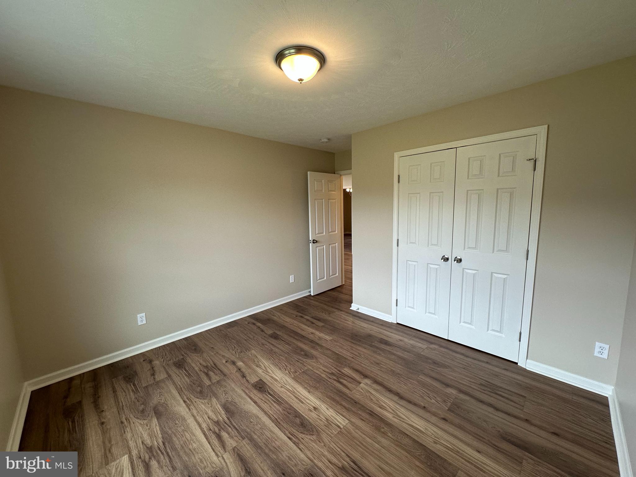 218 Honeyville Road Stanley, VA 22851 - Photo 21 of 27 a view of an empty room with wooden floor