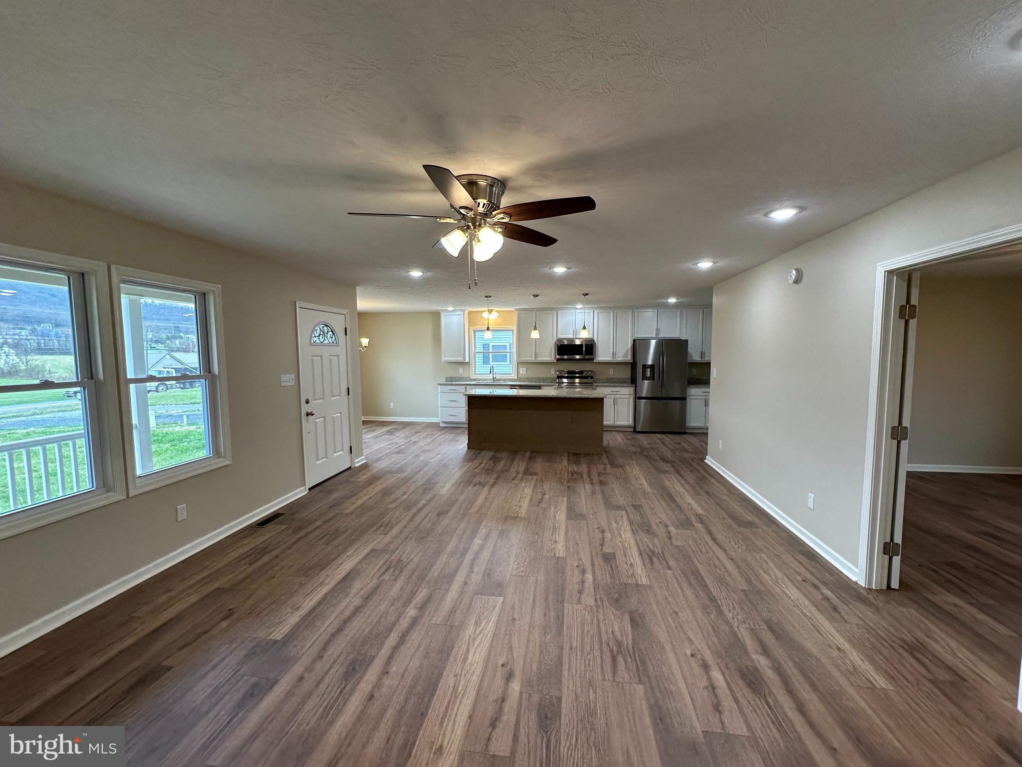 218 Honeyville Road Stanley, VA 22851 - Photo 22 of 27 a view of a livingroom with furniture a ceiling fan and window