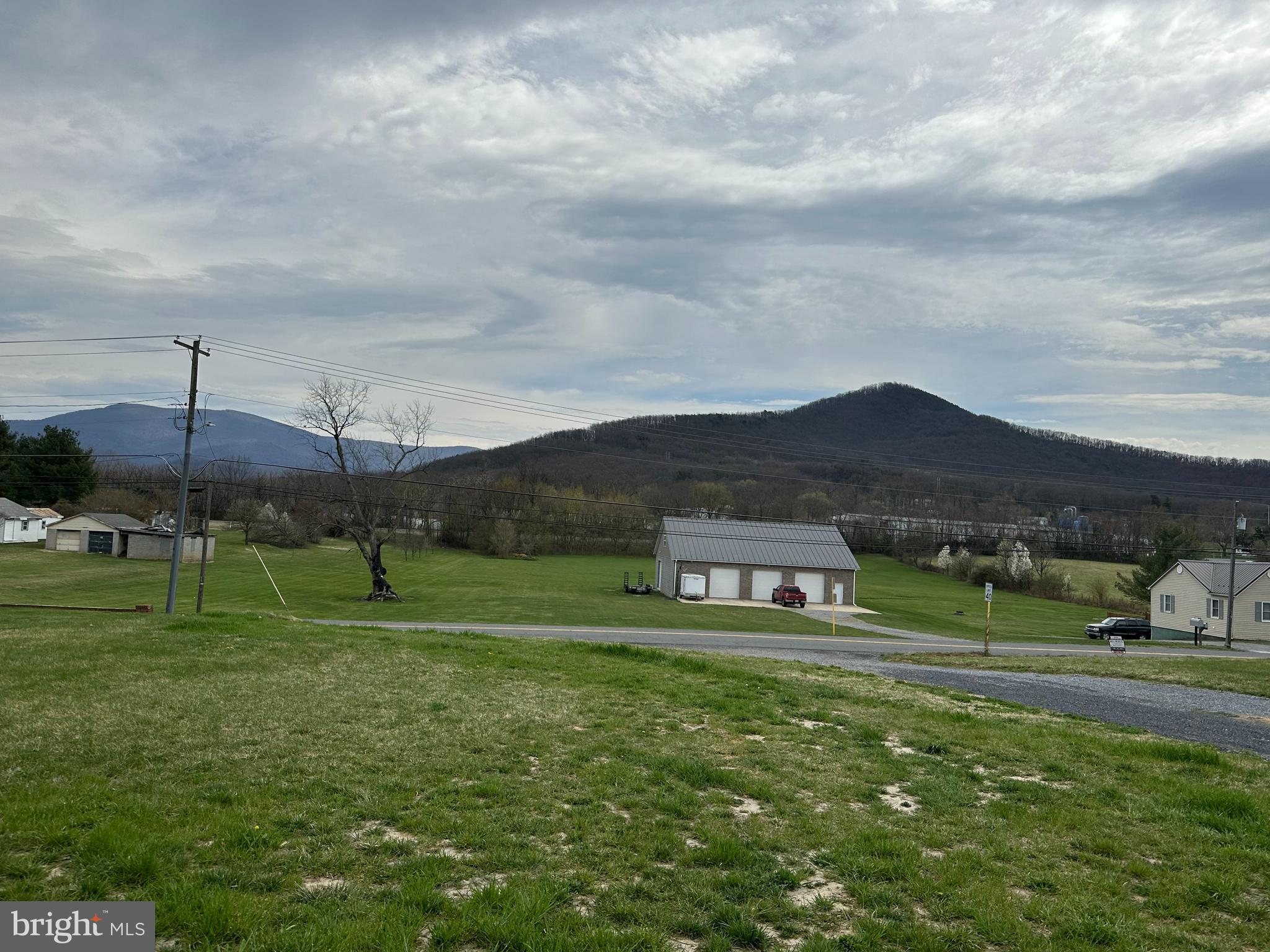 218 Honeyville Road Stanley, VA 22851 - Photo 25 of 27 a green field with lots of trees in the background