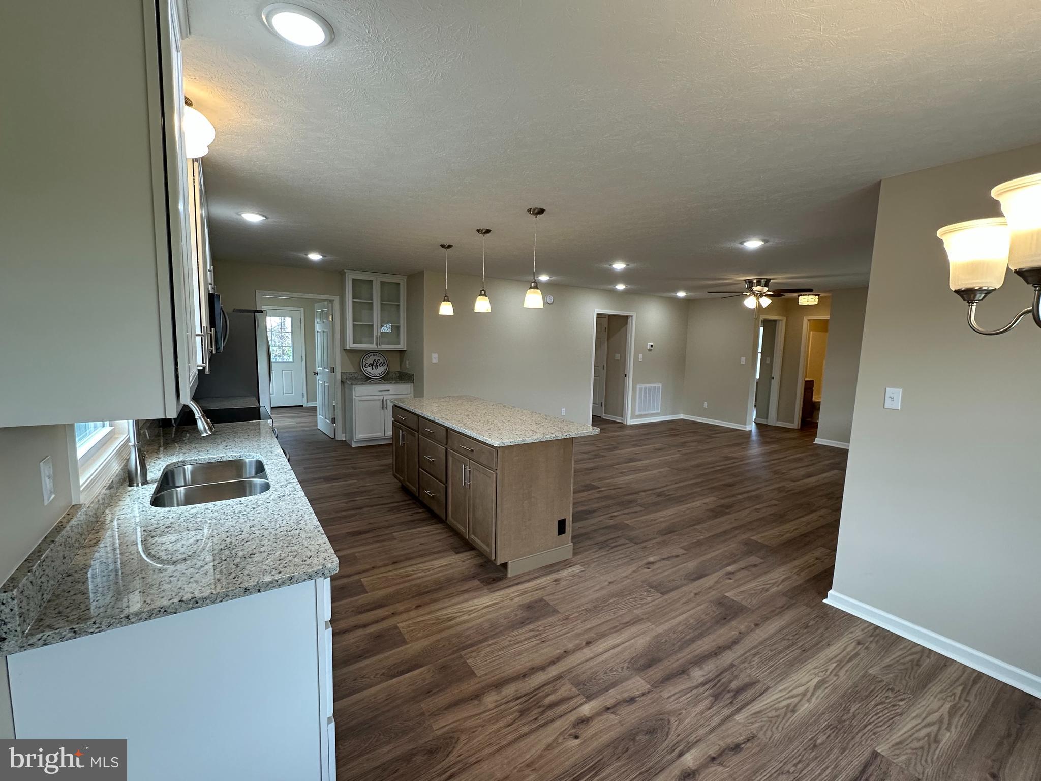218 Honeyville Road Stanley, VA 22851 - Photo 10 of 27 a large room with lot of counter top and wooden floor