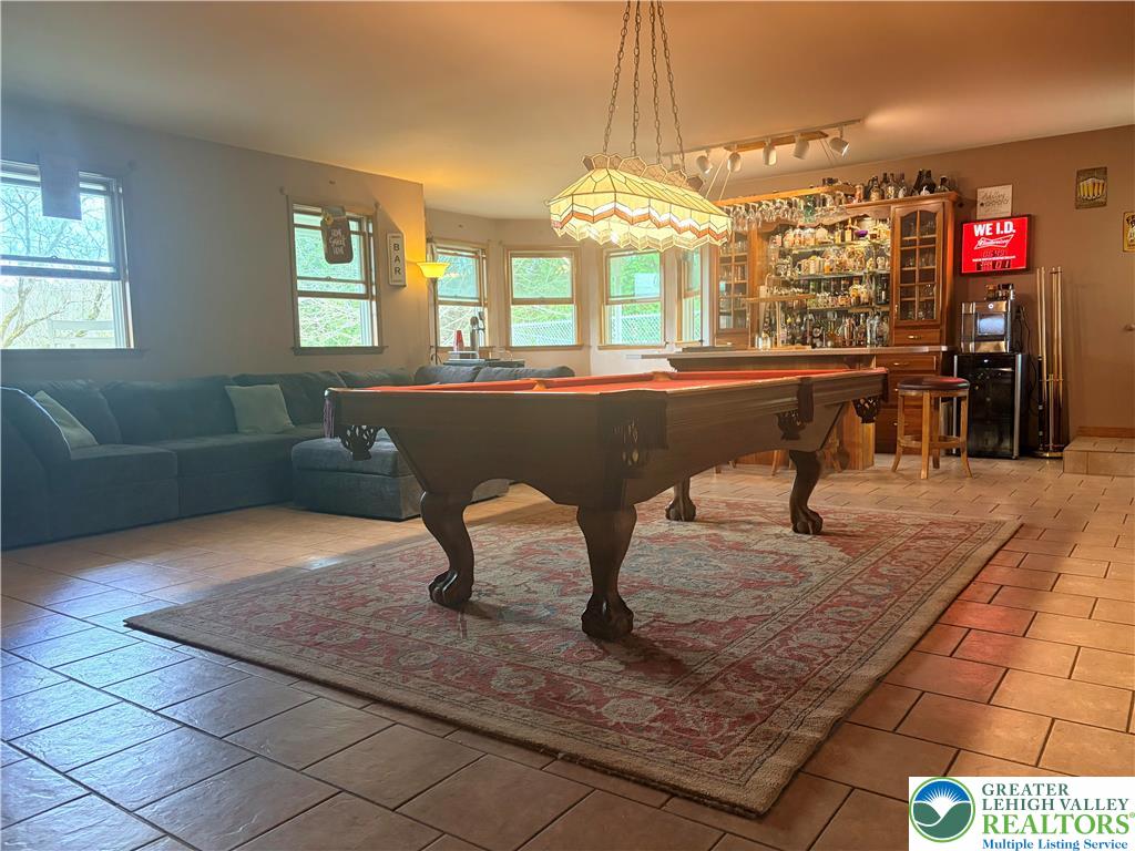 100 Hazelwood Road Lehighton, PA 18235 - Photo 6 of 31 a living room with furniture a chandelier and a dining table