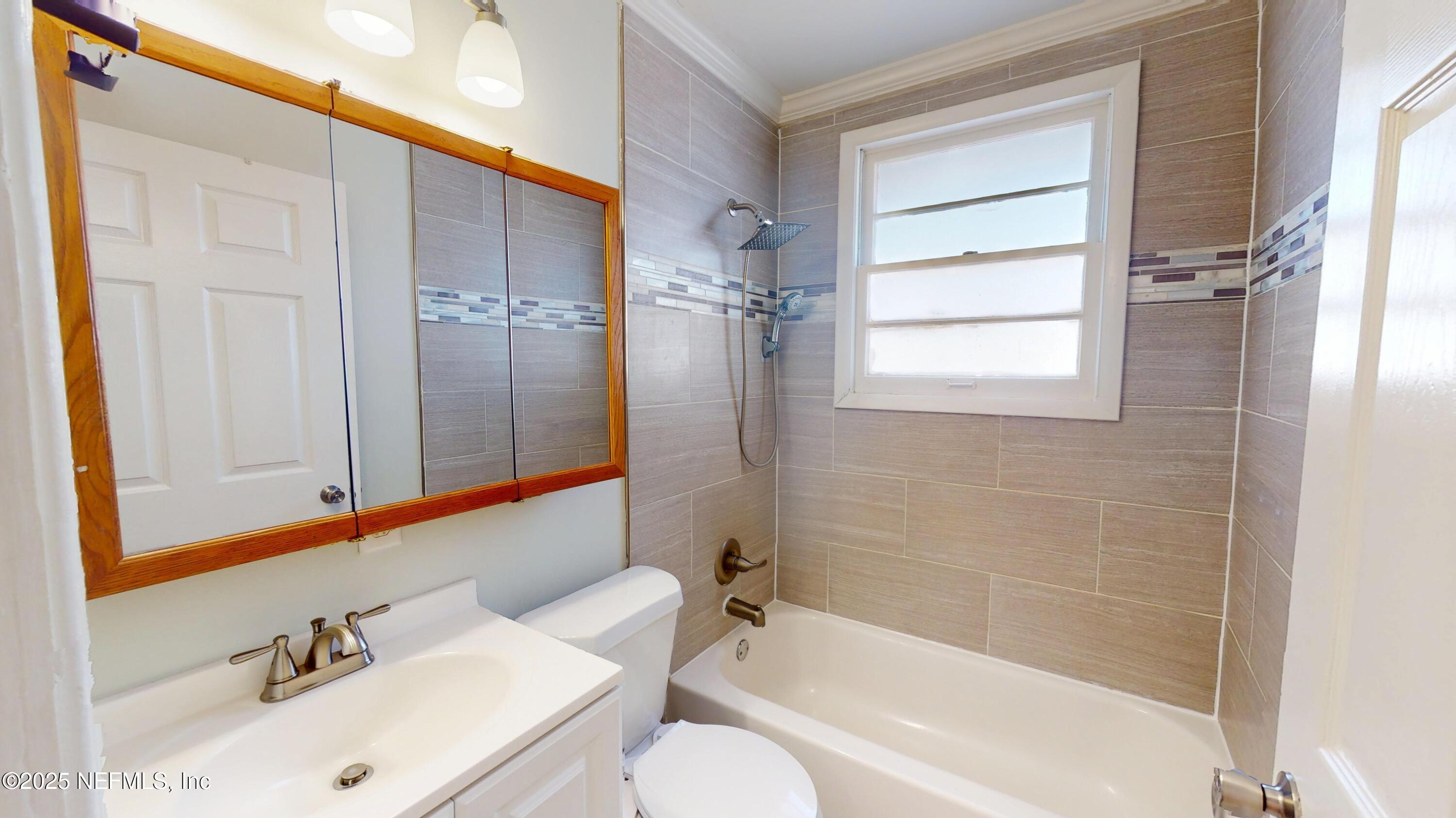 4547 Post Street Jacksonville, FL 32205 - Photo 15 of 23 a bathroom with a sink toilet and shower