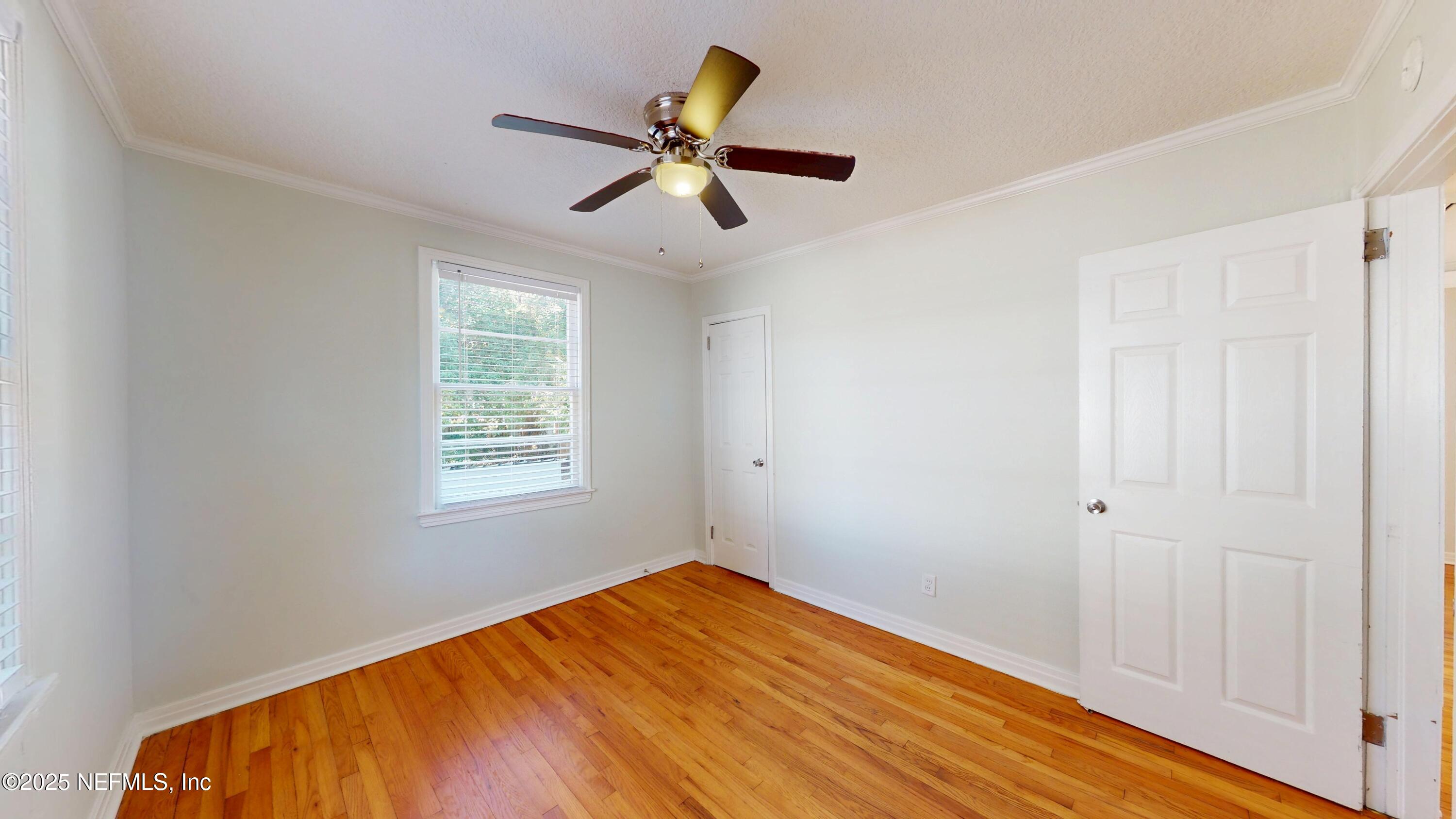 4547 Post Street Jacksonville, FL 32205 - Photo 17 of 23 a view of empty room with wooden floor and fan